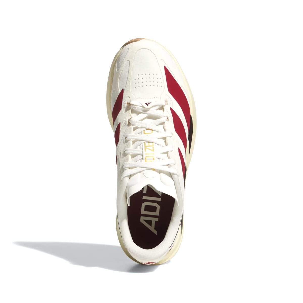 The Adidas Women’s Adizero EVO SL EXO Suede Running Shoes in Core White, Team Victory Red, and Cream White are showcased from above against a white background, highlighting their white athletic design with red stripes, gold ADIZERO text on the tongue, and advanced EXOSKELETON Fit System for enhanced support.