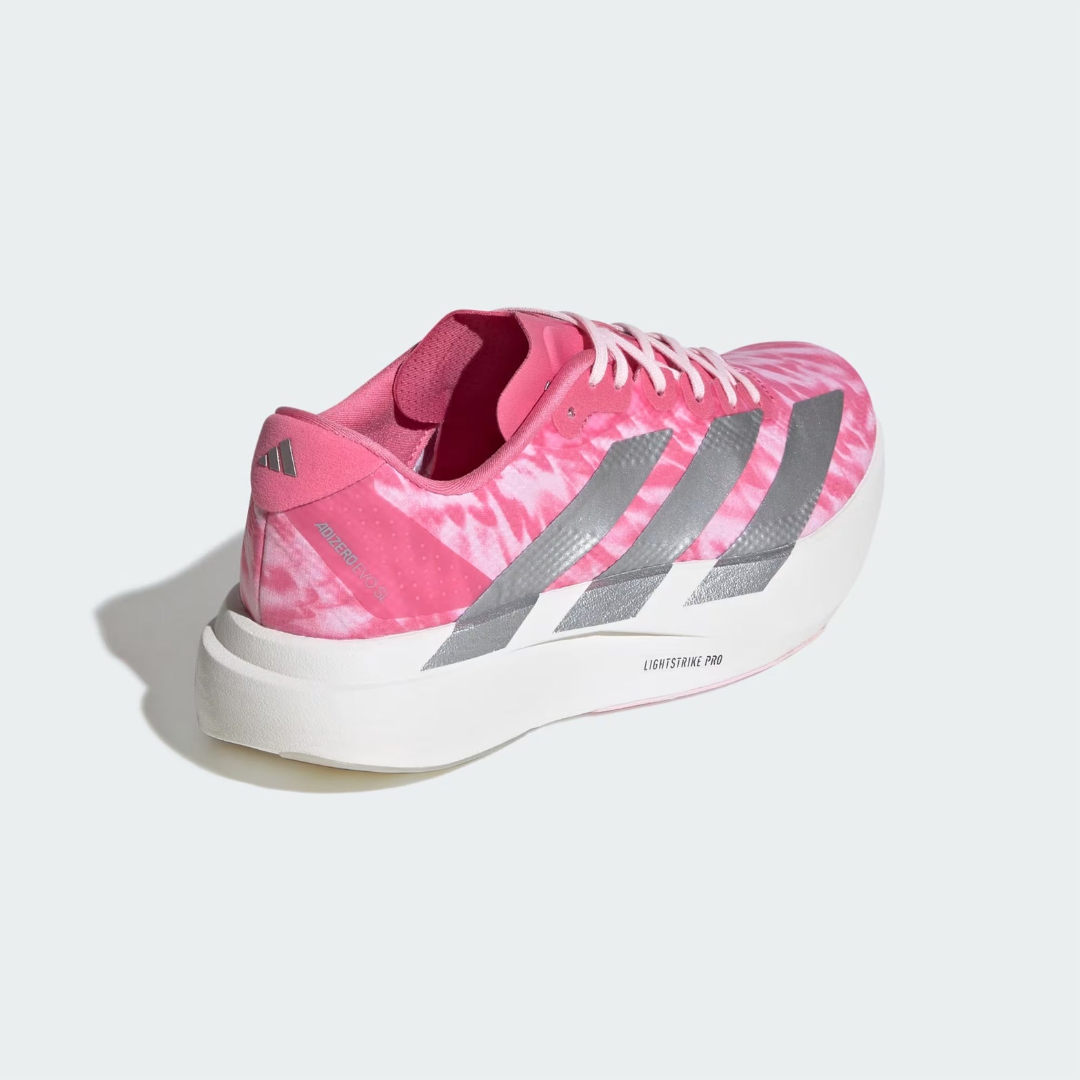 adidas Adizero EVO SL Woven women's running shoe in Pink Fusion / Silver Metallic / Clear Pink — angled rear view showing woven heel construction, silver metallic 3-Stripes and clear pink midsole contrast