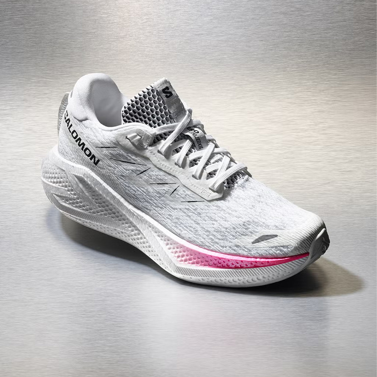 Women's Salomon Aero Glide 4 Running Shoes White White angled side view showing Reverse Camber rocker with energyFOAM midsole and road-specific outsole for effortless daily running