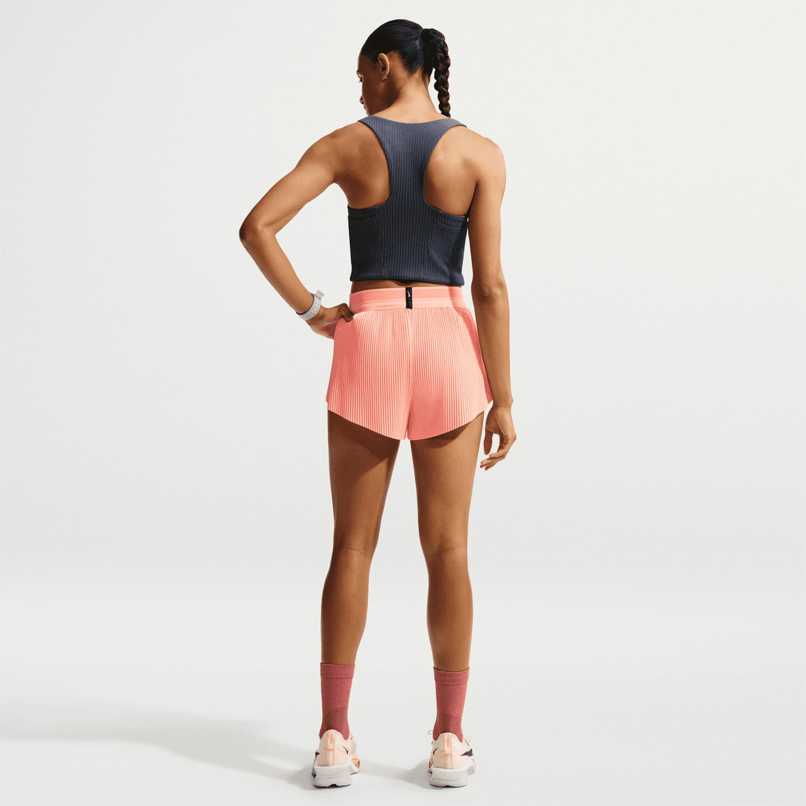 Women's Nike Aeroswift Dri-FIT ADV Cropped Running Tank Thunder Blue Linen back full body view on female runner showing drop-in gel pockets with Dri-FIT ADV moisture management and silky-smooth lined construction