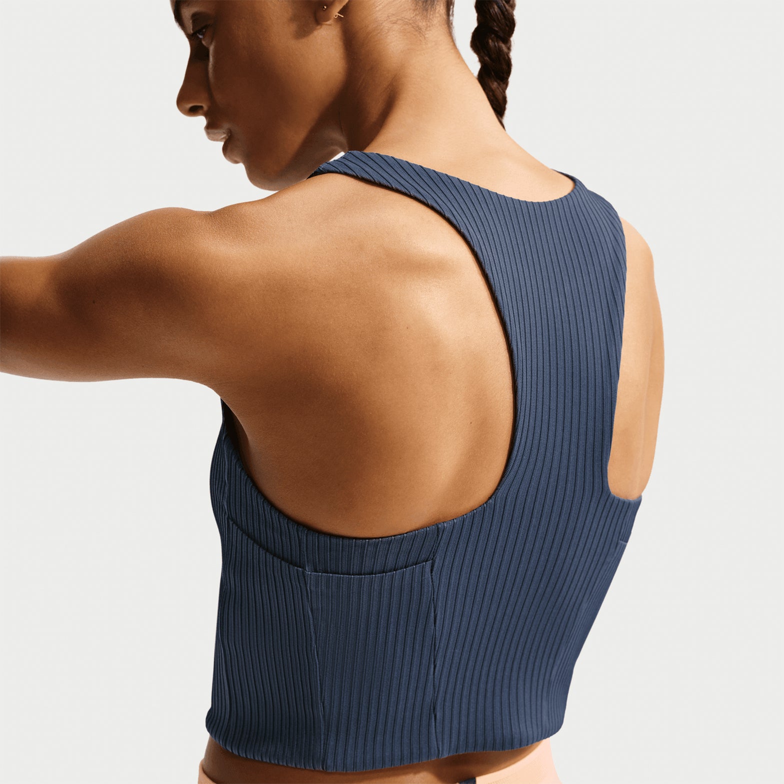 Women's Nike Aeroswift Dri-FIT ADV Cropped Running Tank Thunder Blue Linen back view on female runner showing drop-in back pockets for gel storage with silky-smooth lining and advanced sweat-wicking construction