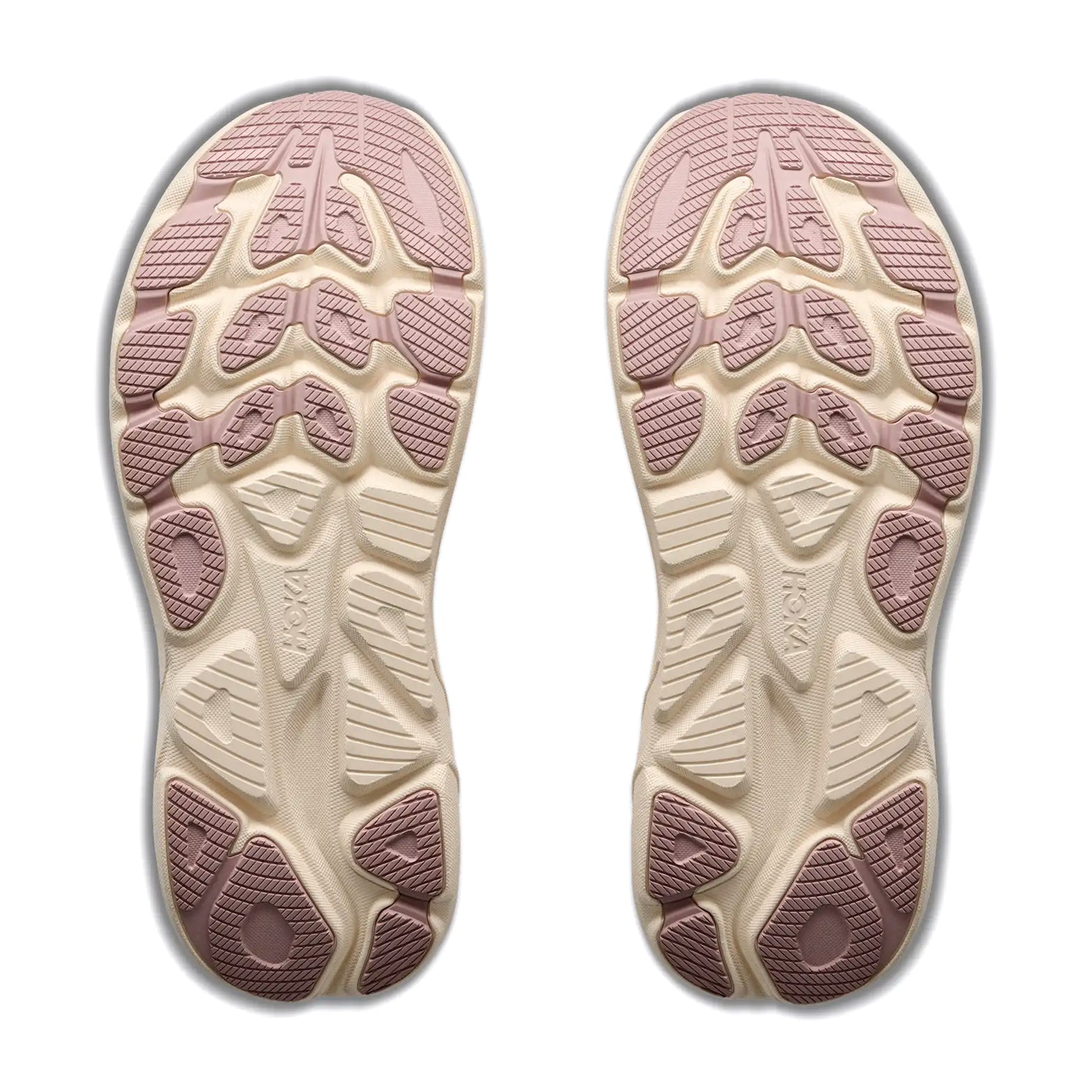A pair of beige outsoles with pink rubber treads, featuring textured patterns and geometric shapes for grip, is shown from the bottom on a white background. Crafted with compression-moulded foam inspired by Hoka running shoes, these soles offer enhanced comfort and support—specifically designed for the Women’s Clifton 11 Glimmers Running Shoes in Pink Opal / Quartzite by Hoka.