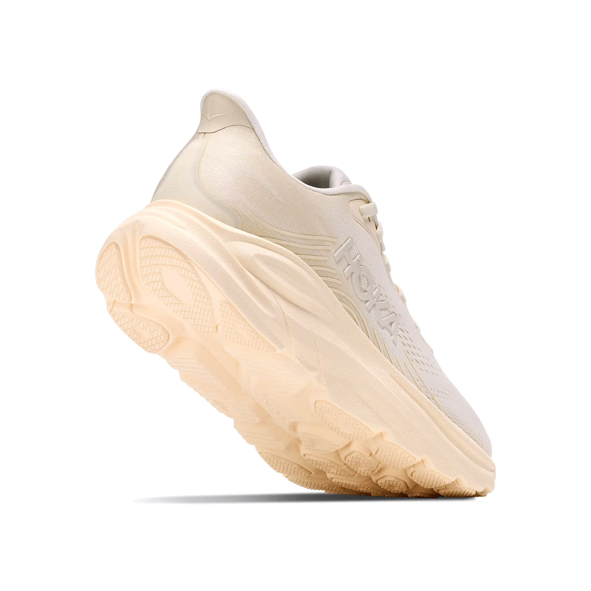 Women's HOKA Clifton 11 Running Shoes Alabaster Oat Milk angled side and heel view showing compression moulded EVA foam with MetaRocker geometry and durable outsole for effortless plush daily road running