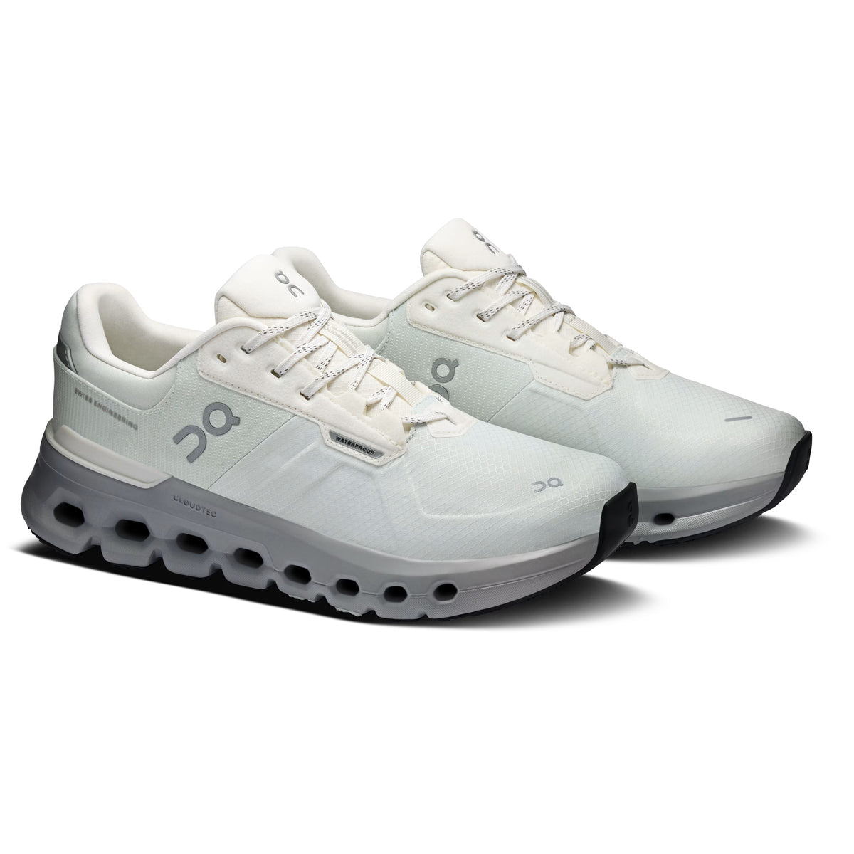 A pair of white athletic running shoes with cushioned soles, black outsoles, and light gray accents, displayed side by side on a white background.