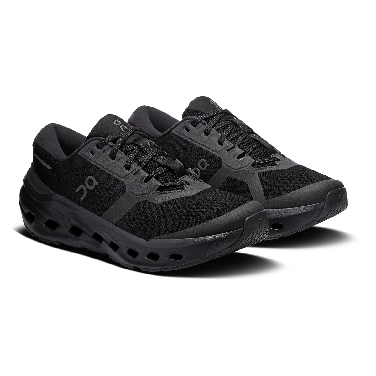 A pair of black athletic running shoes with mesh uppers, cushioned soles, and black laces, shown on a white background.