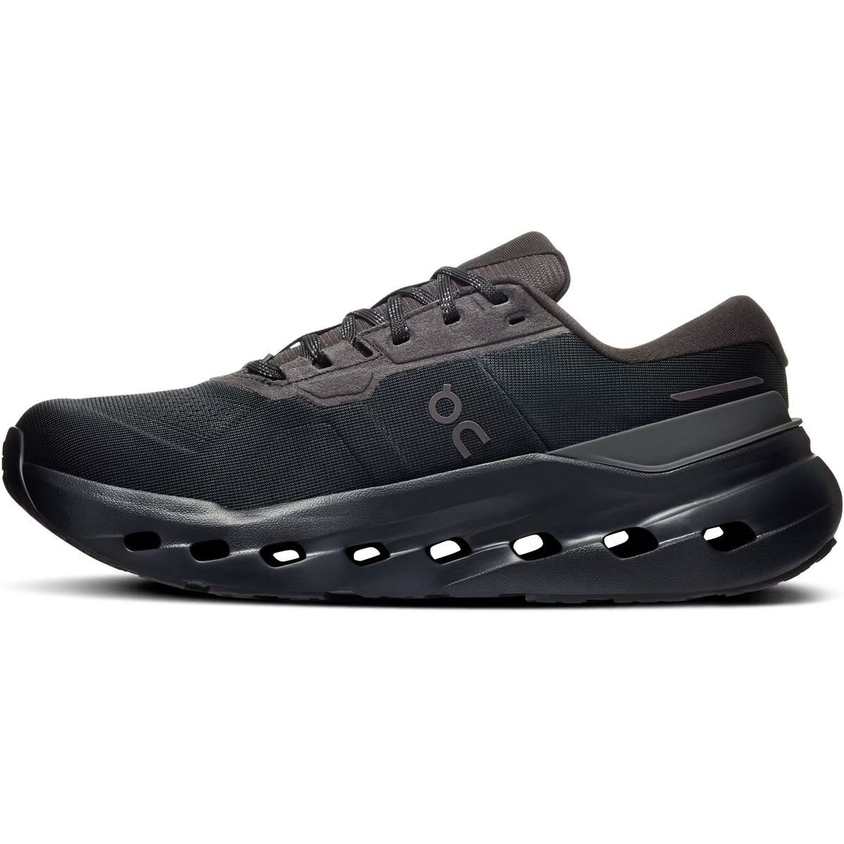 The Women’s Cloudrunner 3 Waterproof Running Shoes by On feature a black mesh upper with laces and ventilation holes along the bottom, paired with a thick, cushioned sole for superior comfort. Designed as one of On’s latest stability running shoes, they offer enhanced support and are finished with the brand’s logo displayed on the side.
