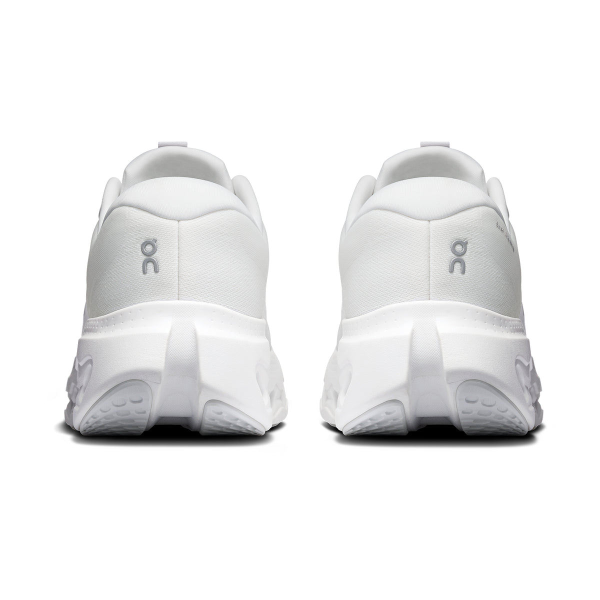 Back view of two white Women’s Cloudsurfer 3 Running Shoes featuring thick, segmented CloudTec Phase soles.