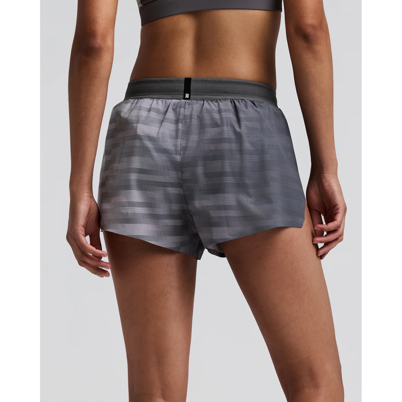 Women's Bandit CoolGrid 3 Inch Split Shorts Uneven Gradient Plaster Slate back view on female runner showing reflective branding at centre back with CoolGrid breathable construction