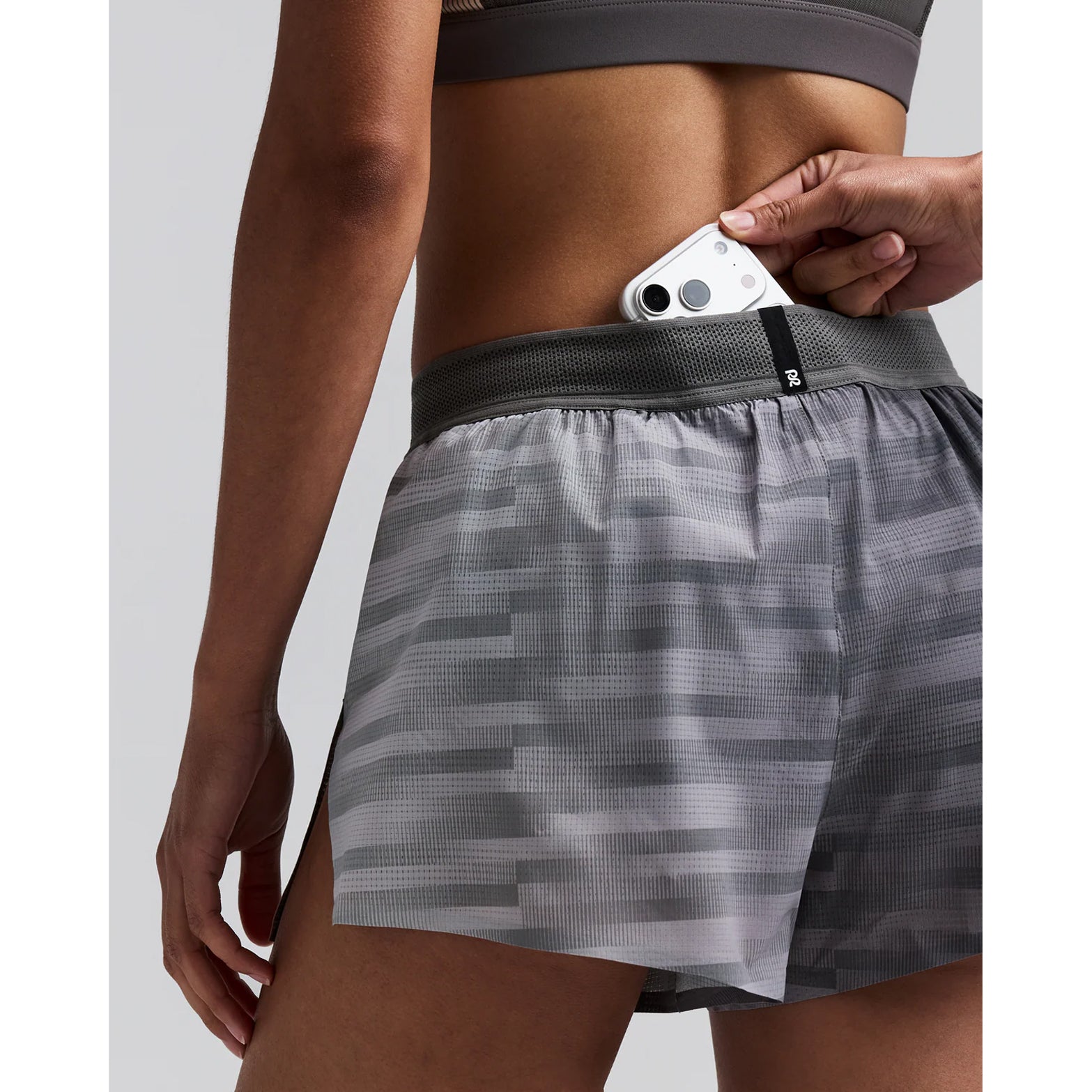 Women's Bandit CoolGrid 3 Inch Split Shorts Uneven Gradient Plaster Slate close-up of waterproof phone pocket showing secure hidden storage with zero-bulk design for race day essentials without bounce
