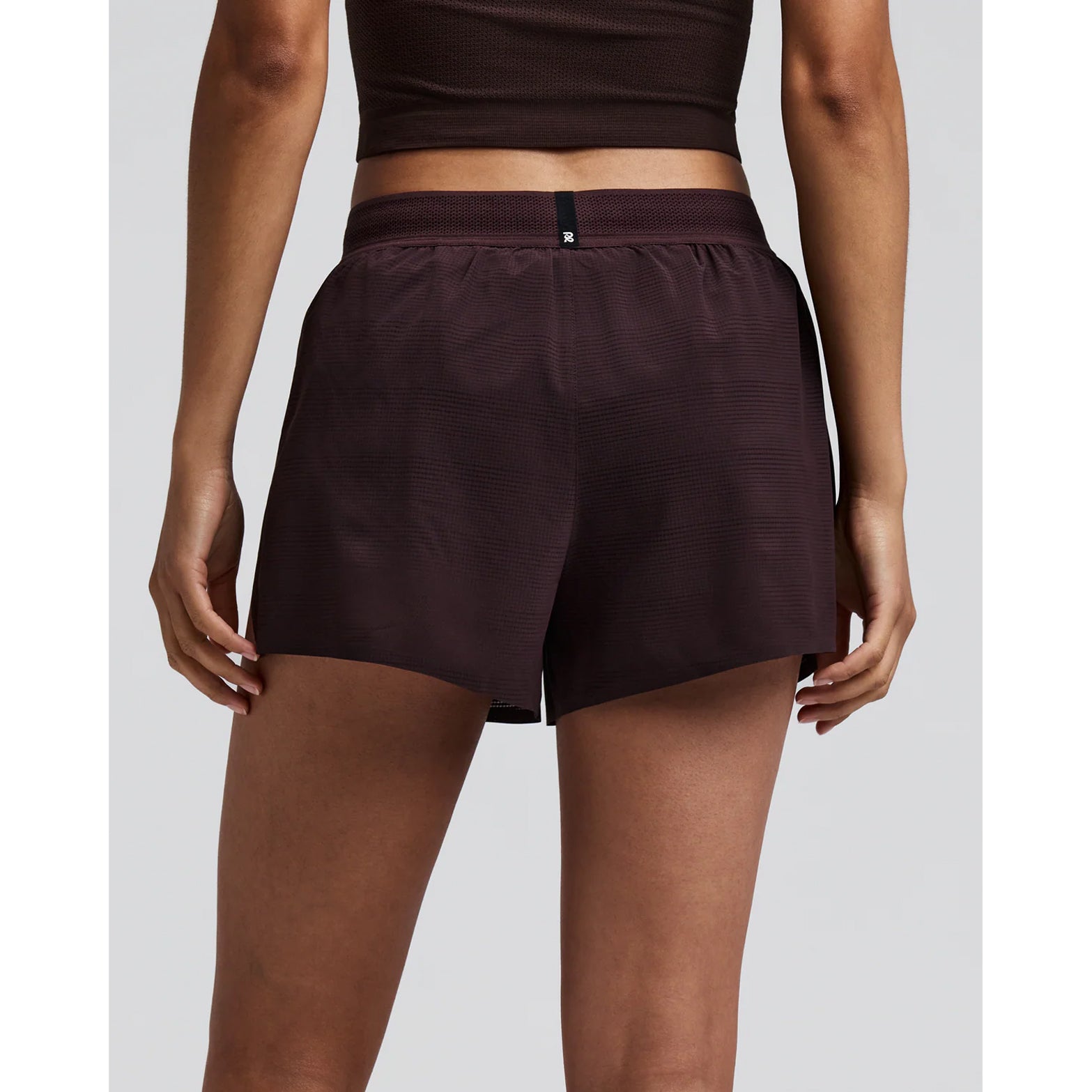 Women's Bandit CoolGrid 3 Inch Split Shorts Espresso back view on female runner showing reflective branding at centre back with CoolGrid breathable construction