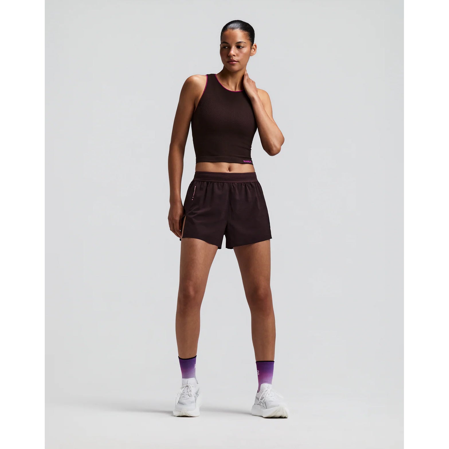 Women's Bandit CoolGrid 3 Inch Split Shorts Espresso front full body view on female runner showing 3-inch split design with mid-rise fit and breathable CoolGrid fabric for road running and racing