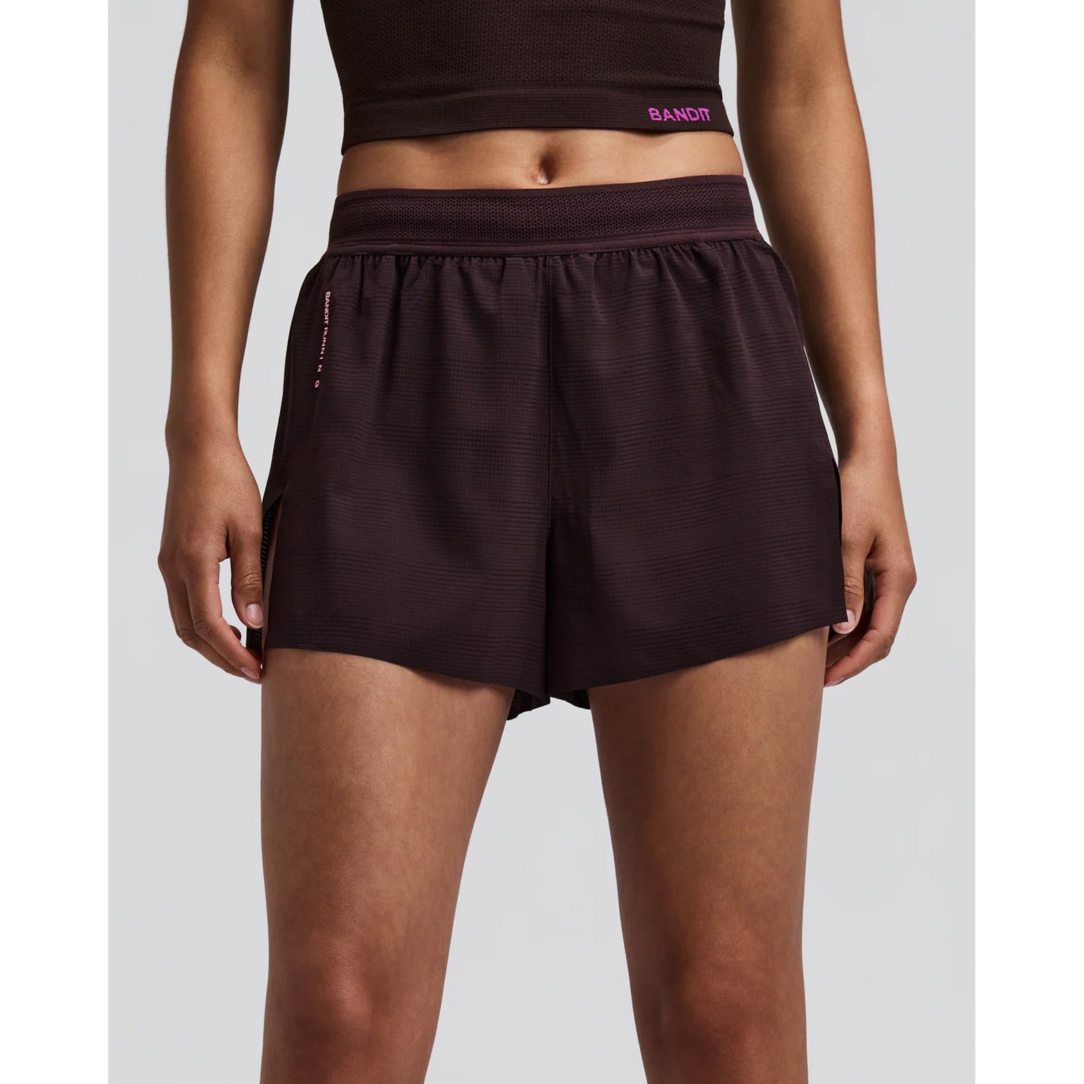Women's Bandit CoolGrid 3 Inch Split Shorts Espresso front view on female runner showing mid-rise fit with two-tone mesh waistband and internal drawstring for adjustable comfort