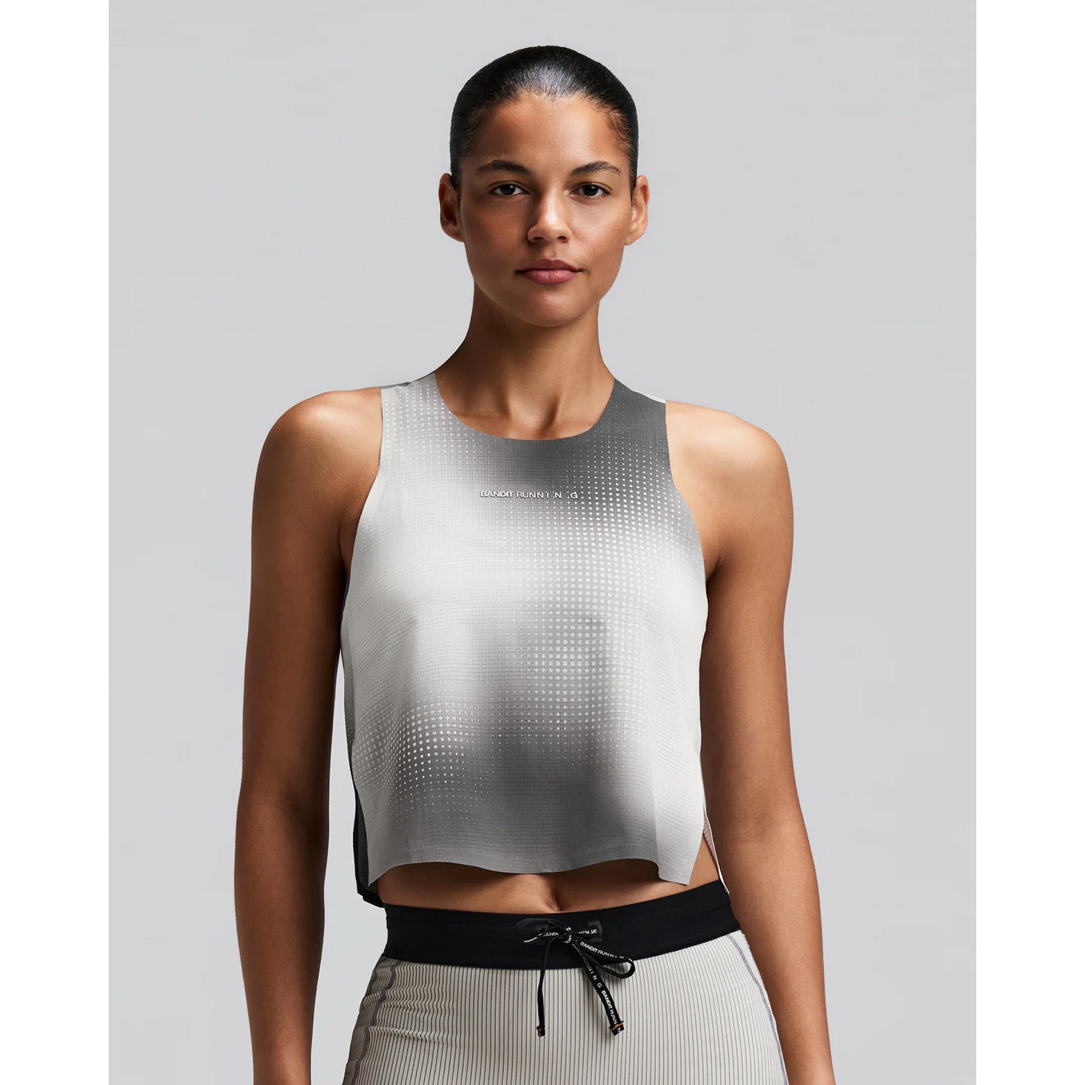 Women's Bandit CoolGrid Race Singlet Slate Multi front view on female runner showing CoolGrid breathable mesh with cool handfeel and two-tone reflective branding for race day performance