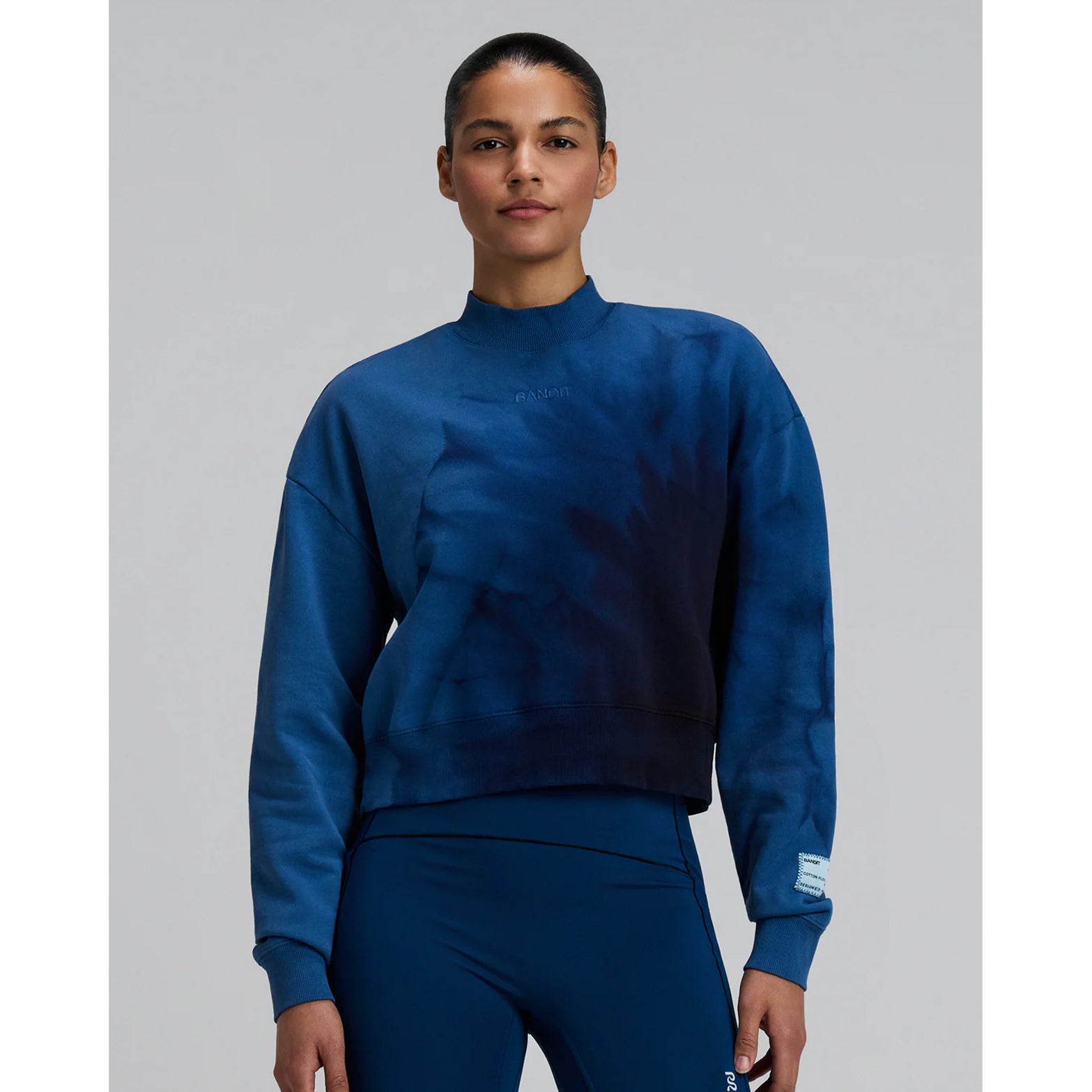 Bandit Cropmock Pullover women's in Aegean Blue Wave Print — front view worn on model showing cropped proportion, mockneck fit, aegean blue wave print and rib trim cuff detail