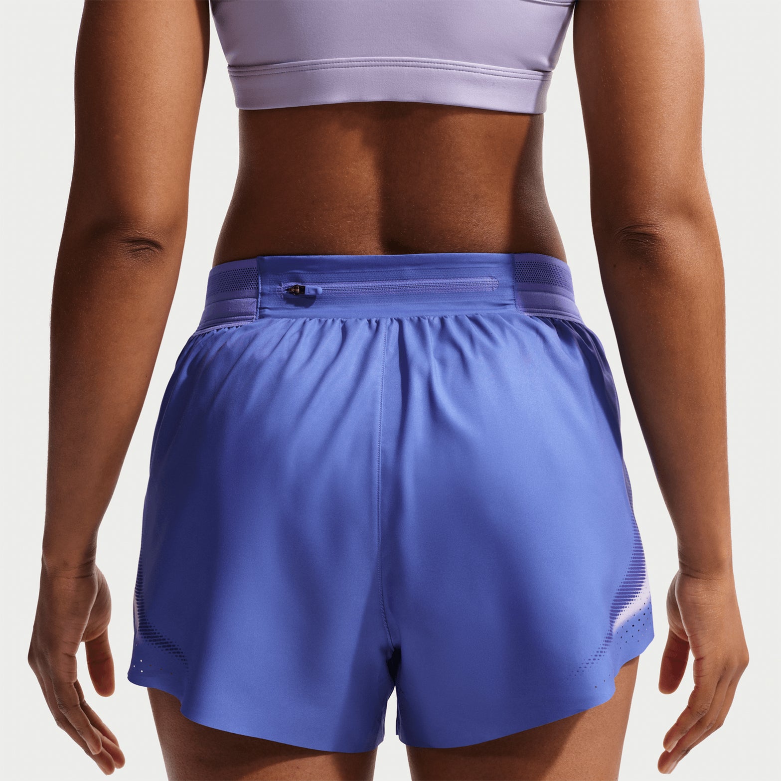 Women's Nike Dri-FIT Aeroswift ADV 3 Inch Running Shorts Sapphire Hot Lava back view on female runner showing 3-inch inseam with breathable racing construction and moisture management