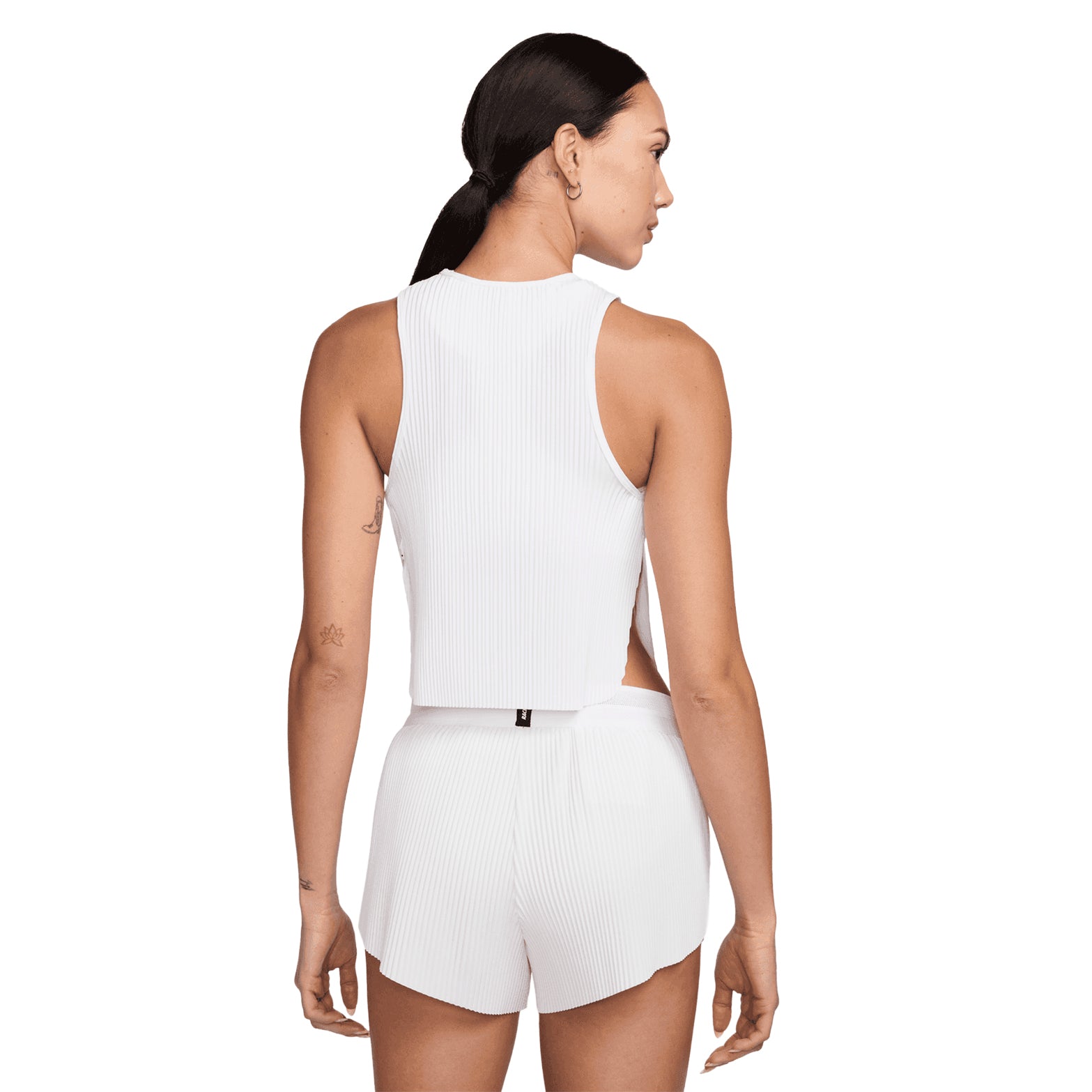 Women's Nike Dri-FIT AeroSwift ADV Running Tank White Black back view on female runner showing pleated back detail and side slits for airflow