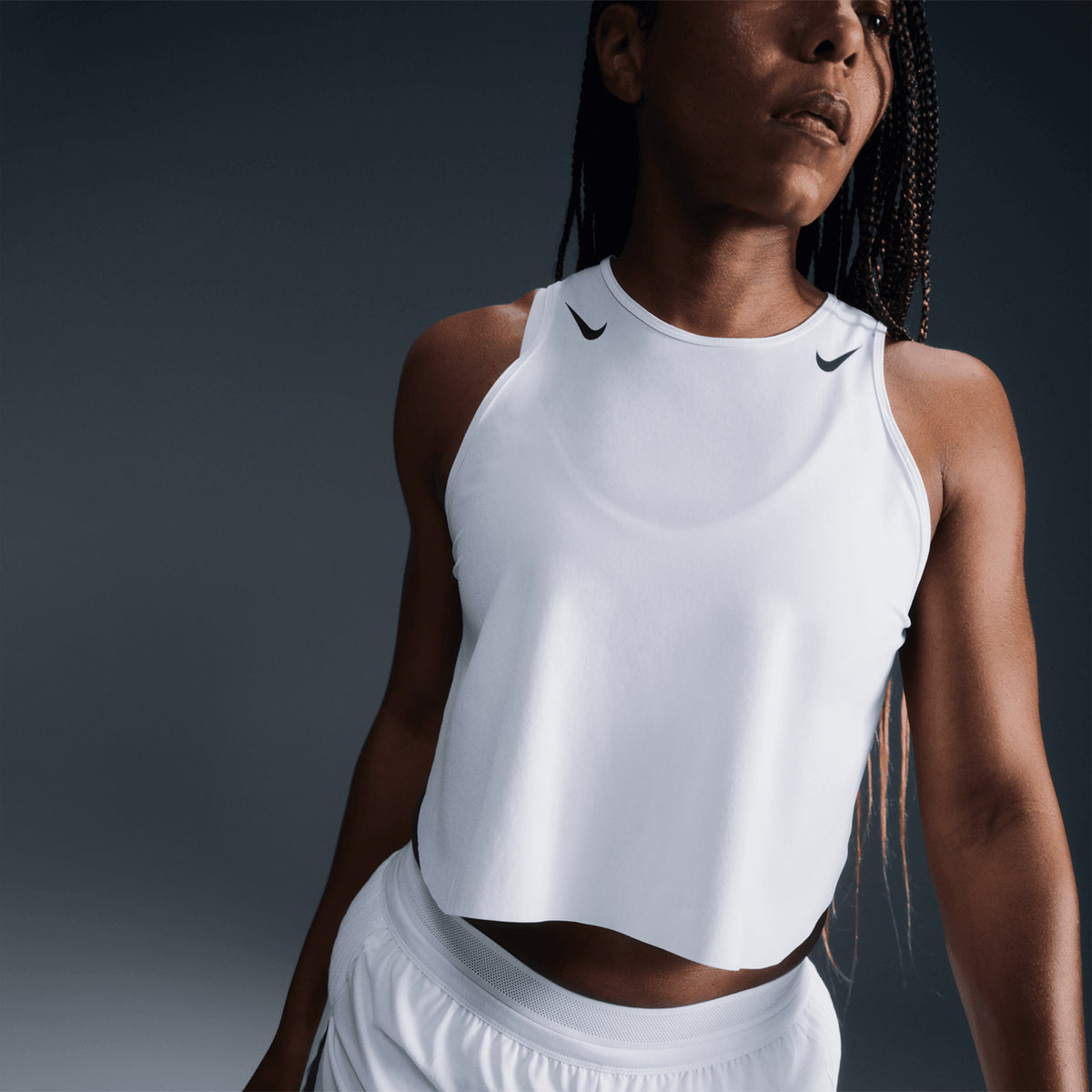 Women's Nike Dri-FIT AeroSwift ADV Running Tank White Black front angled close-up showing lightweight fabric, cropped design and advanced engineering construction