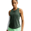 Women's Nike Dri-FIT Aeroswift Running Tank Black Light Green Spark Reflective Silver front view on female runner showing Aero-FIT peak breathability with curved hem for stride freedom during running