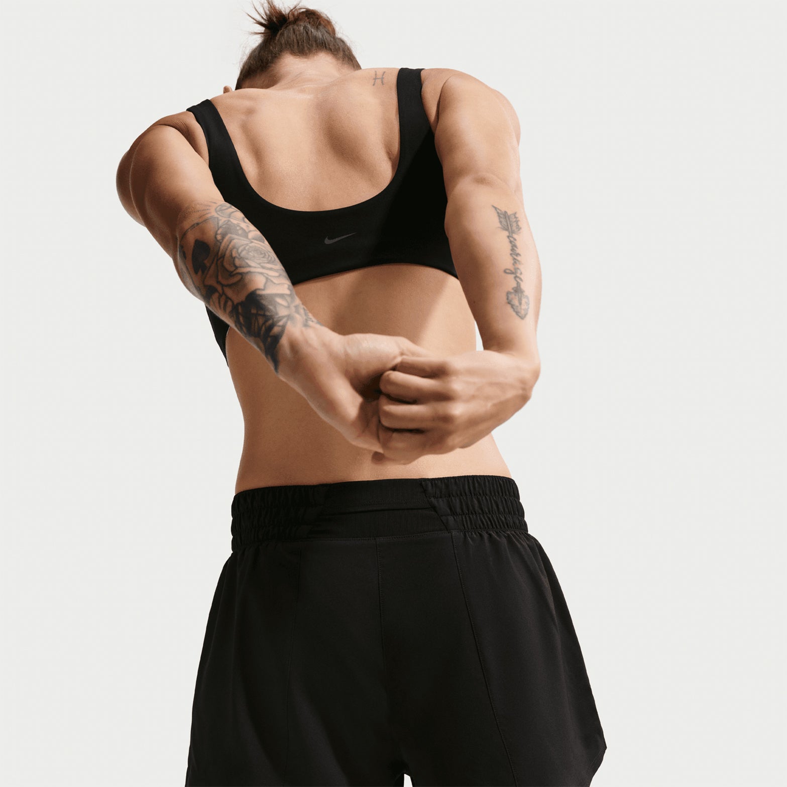 Women's Nike Dri-FIT High-Waisted 3 Inch 2-in-1 Shorts Black White close-up back showing snug inner layer and moisture-wicking construction