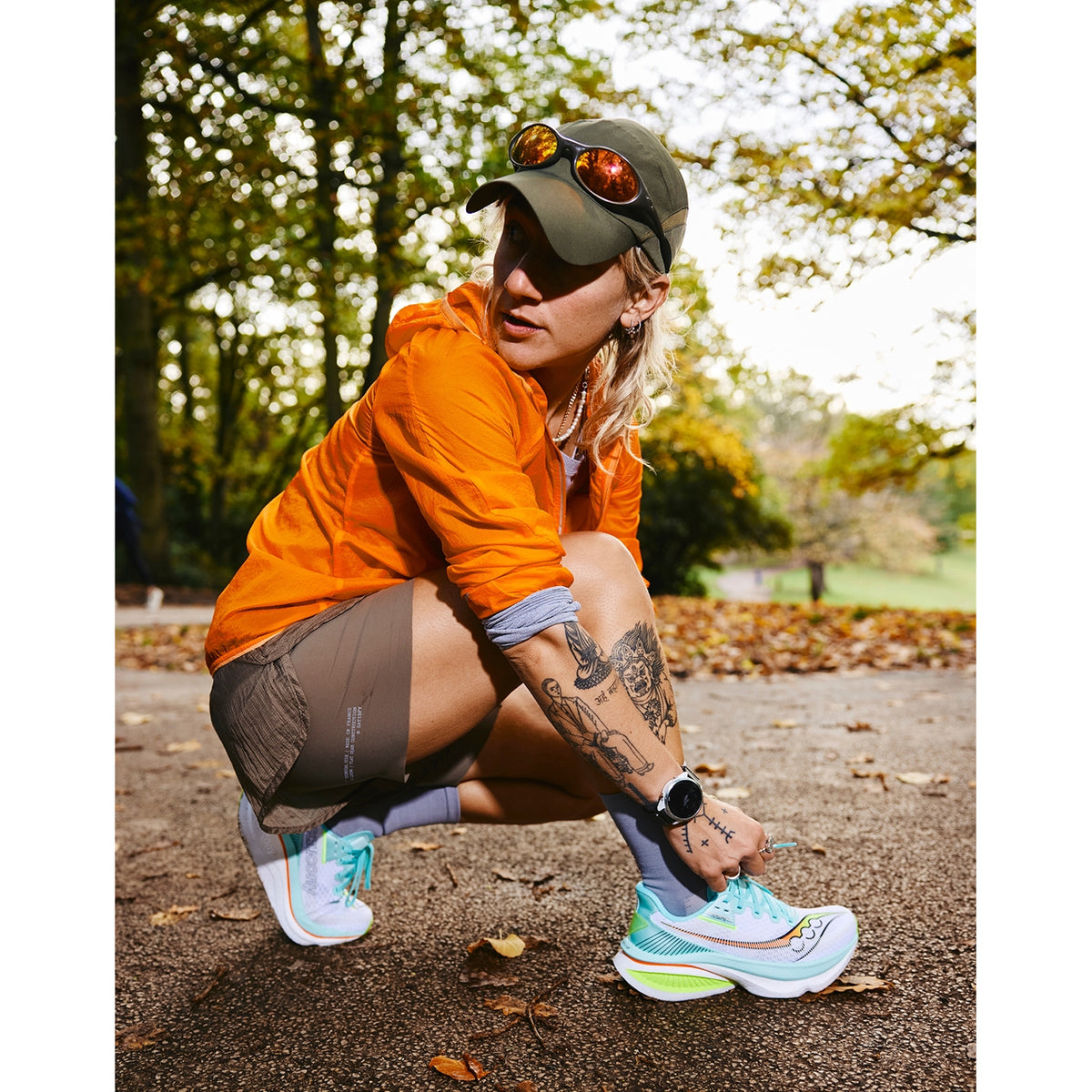 Women's Saucony Endorphin Azura Running Shoes White Splash worn by female runner showing fit and SpeedRoll midsole profile on road