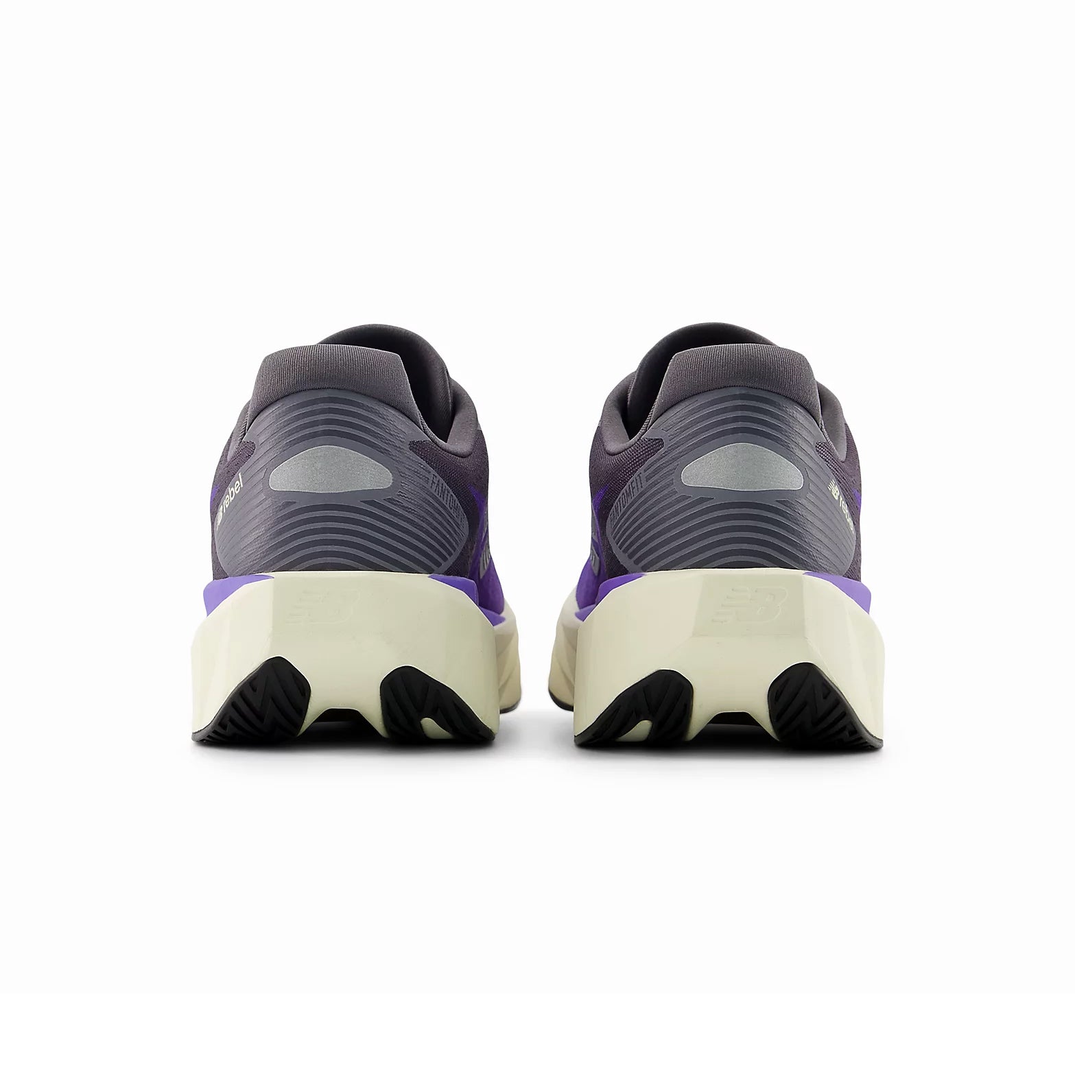 New Balance FuelCell Rebel v5 Electric Indigo Truffle Salt Silver Metallic heel view pair highlighting redesigned heel and higher stack geometry