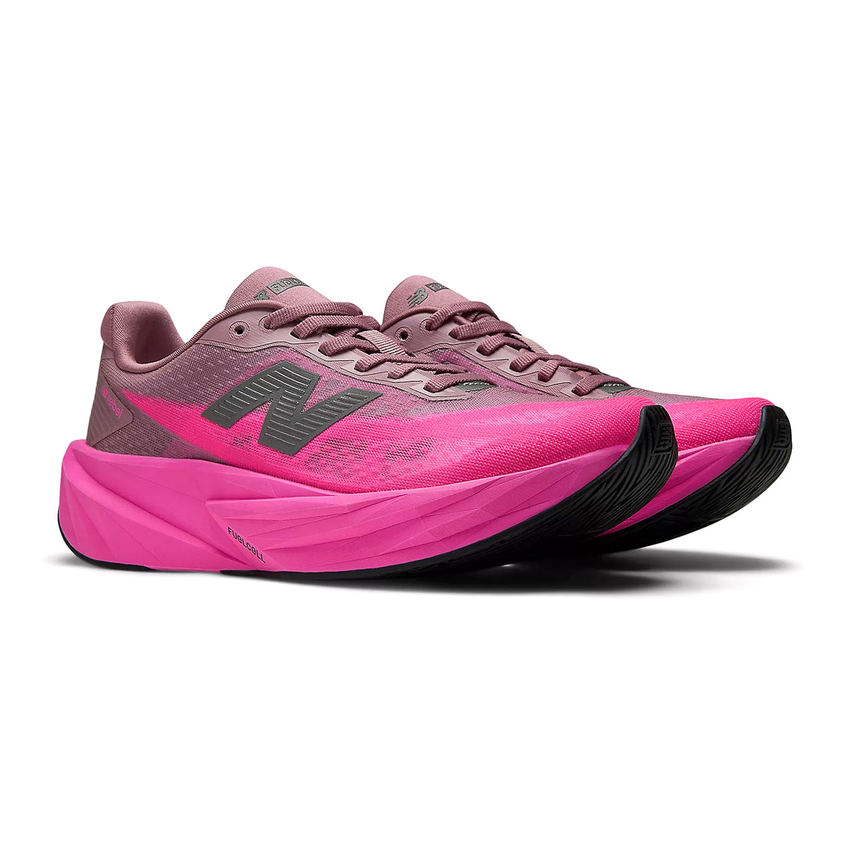 New Balance FuelCell Rebel v5 women's running shoe in Pink Heat / Rosewood — angled side view showing pink heat mesh upper, bold geometric FuelCell midsole profile and rosewood accent detailing