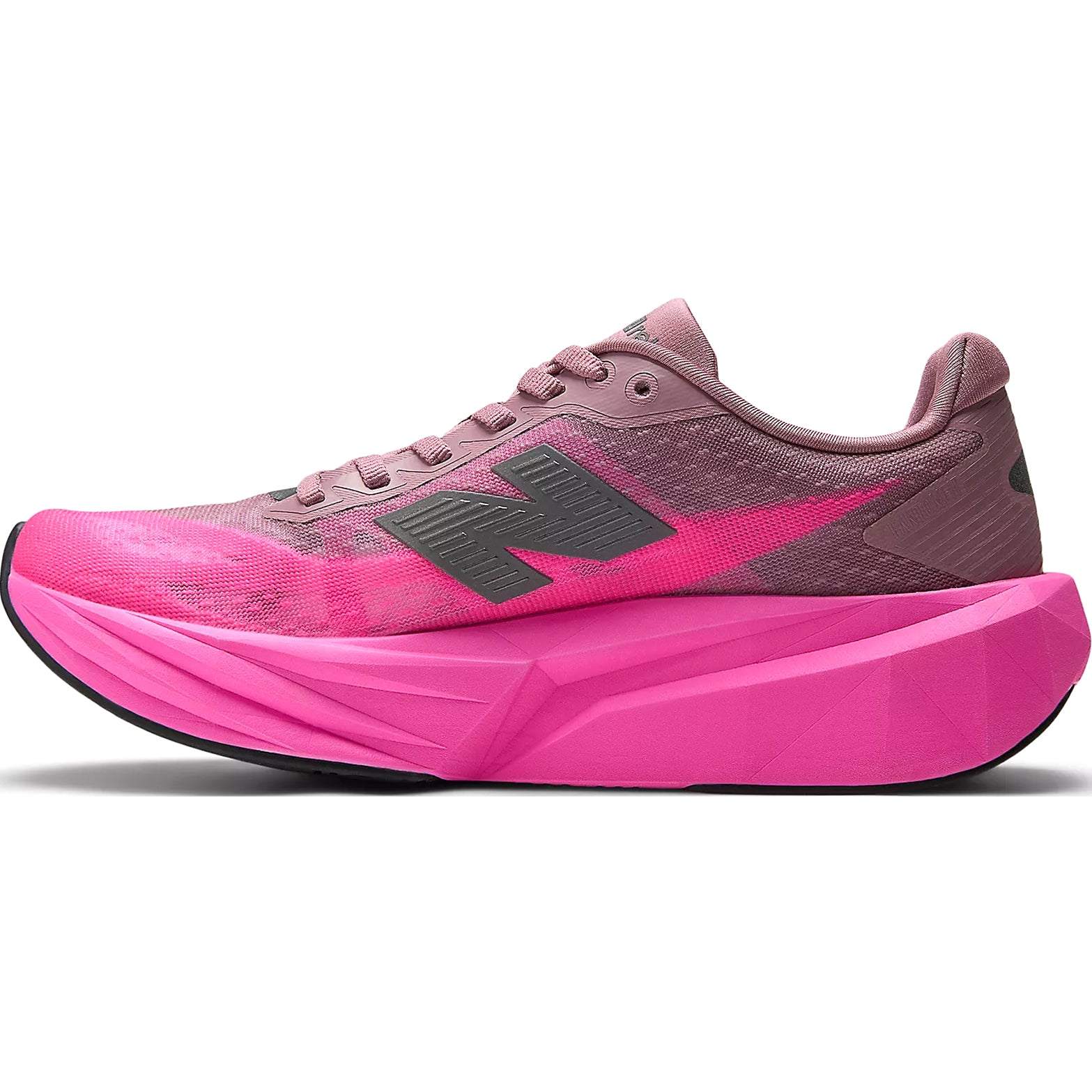 New Balance FuelCell Rebel v5 women's running shoe in Pink Heat / Rosewood — inner view showing pink heat mesh upper, rosewood midsole detailing and redesigned heel construction