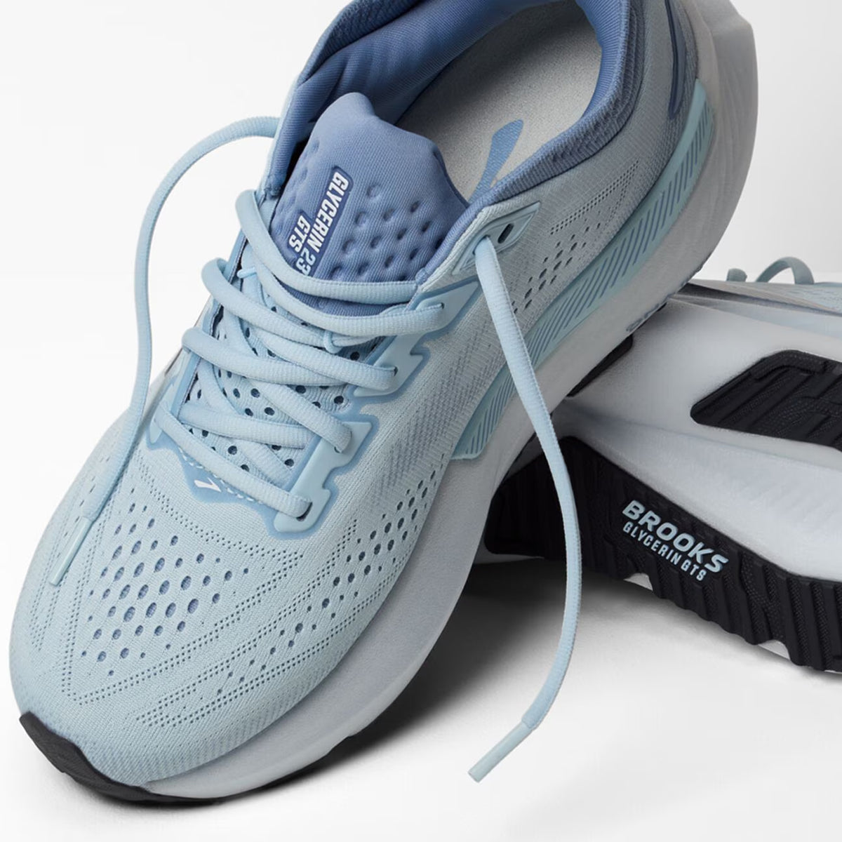 Brooks Glycerin GTS 23 women's running shoe in Nantucket Breeze / Rain / Clear — angled side view showing nantucket breeze engineered knit upper, GuideRails support sidewalls and rain DNA TUNED cushioning midsole stack with 8mm offset profile
