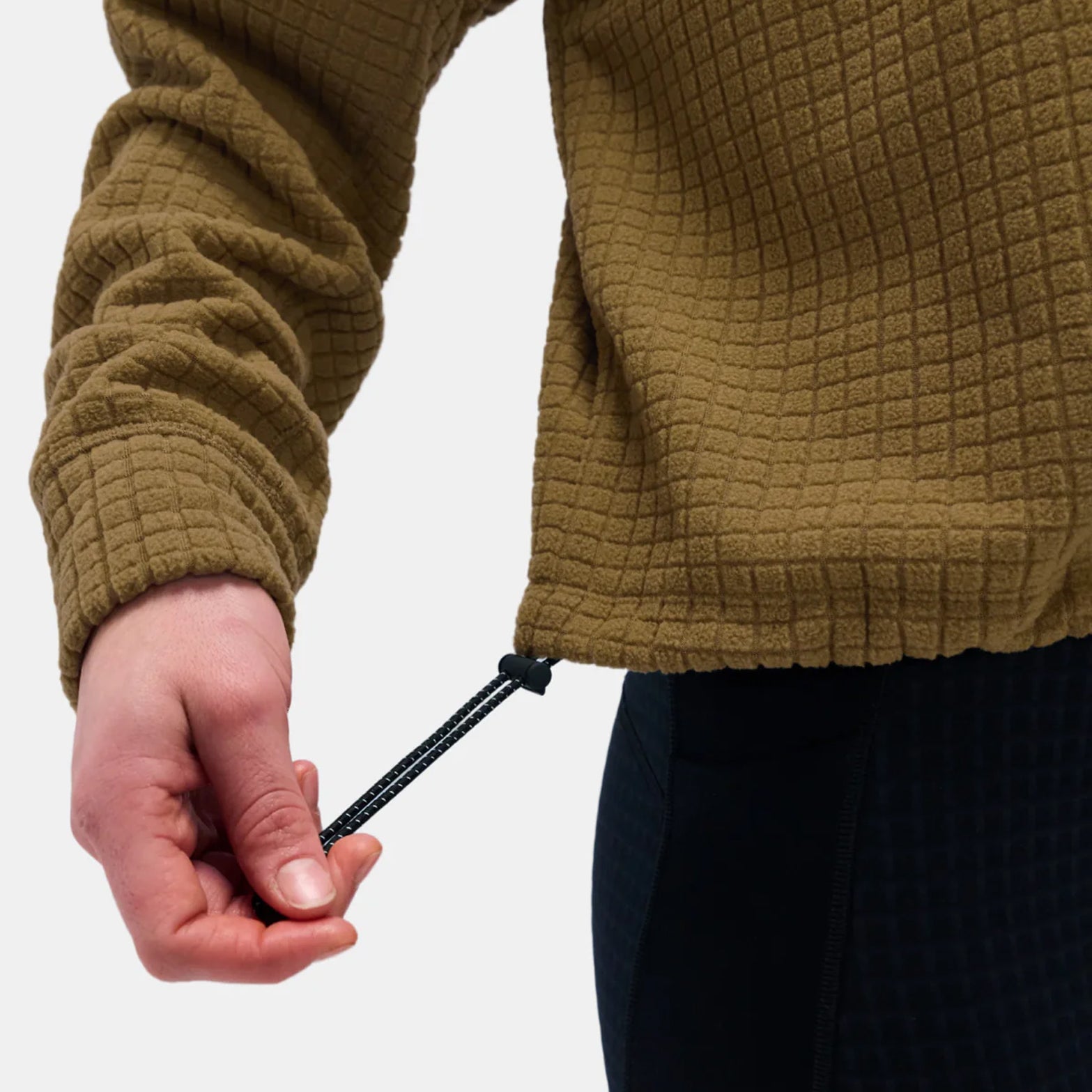 Bandit MacroSoft Grid Quarter Zip hem closeup showing adjustable bungees and cordstopper for customized fit