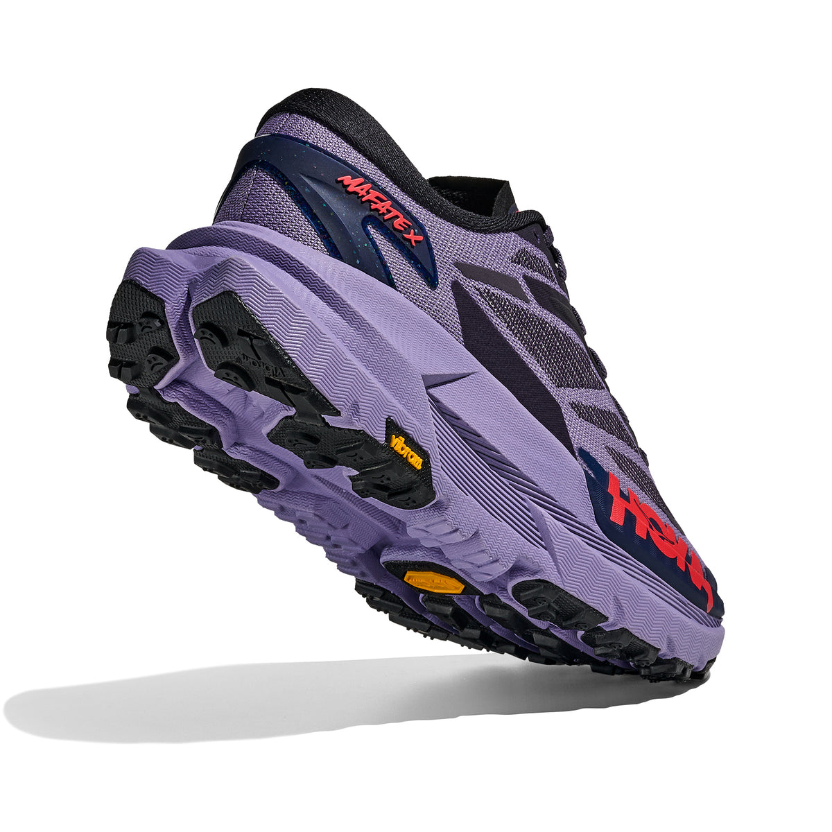 HOKA Mafate X women's trail running shoe in Berry Jam / Squid Ink — angled side view showing berry jam woven textile upper, forked carbon fibre plate profile, MetaRocker™ geometry and squid ink dual-density midsole stack