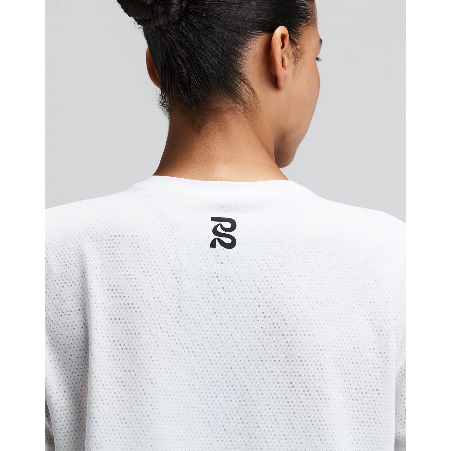 Women's Bandit Micromesh Cropped Run Tee White close-up of back showing fast-drying Micromesh fabric with sweat-wicking airflow construction for sustained running efforts