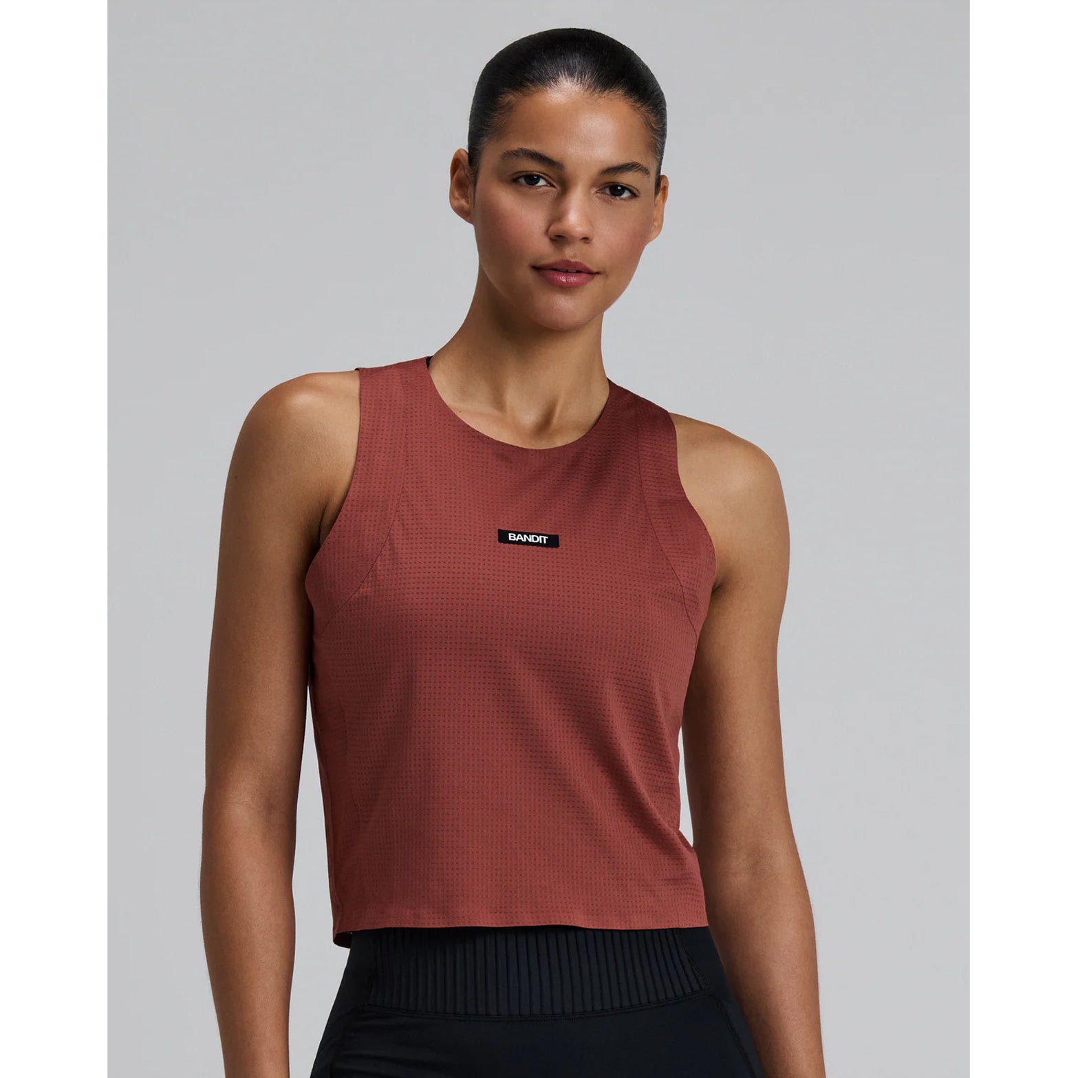 Women's Bandit GeoMesh Race Singlet Mahogany front view showing GeoMesh performance knit fabric with bonded finishing at neckline and armholes