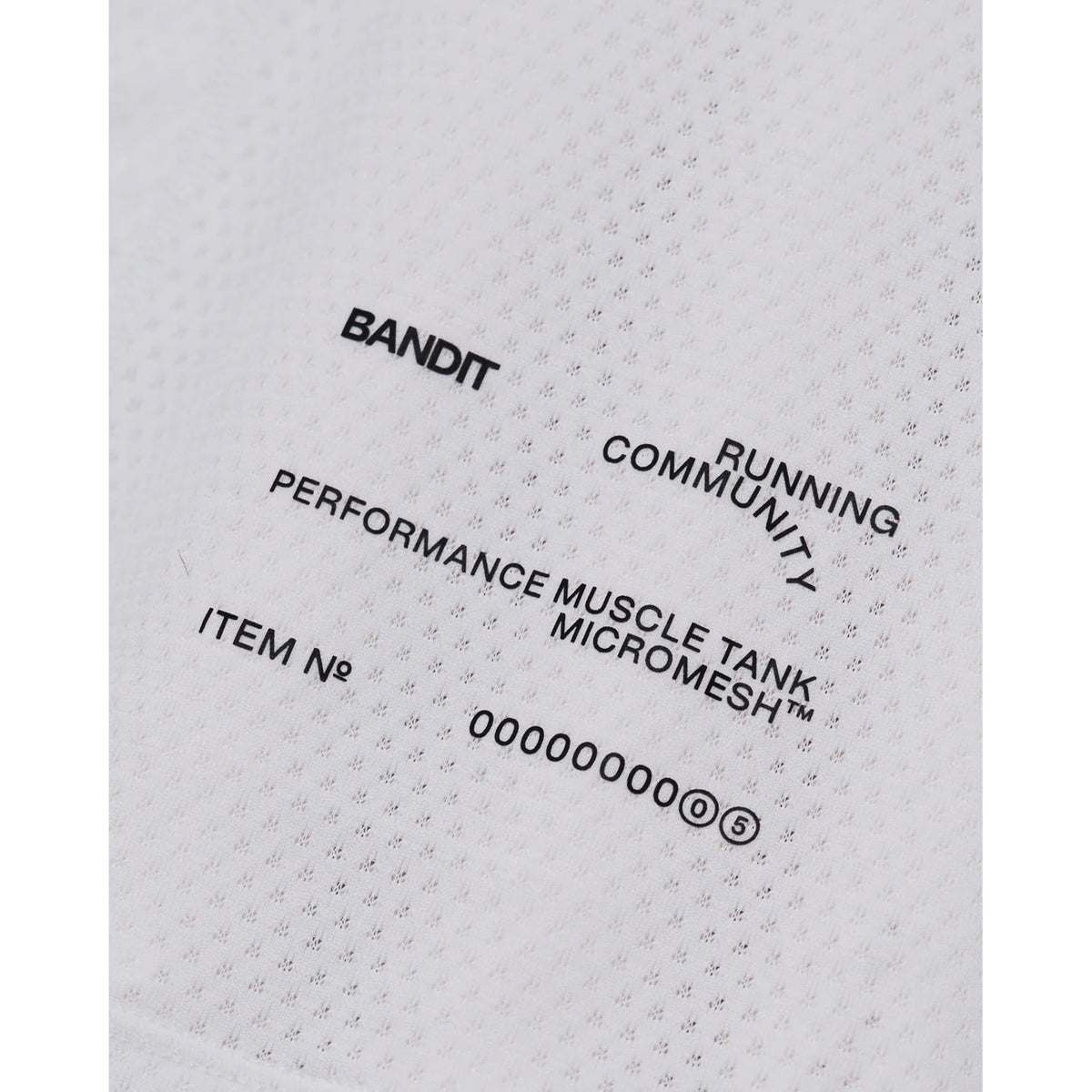andit Micromesh Run Tank women's in White — closeup showing reflective logo detail at front on white Micromesh™ breathable fabric construction
