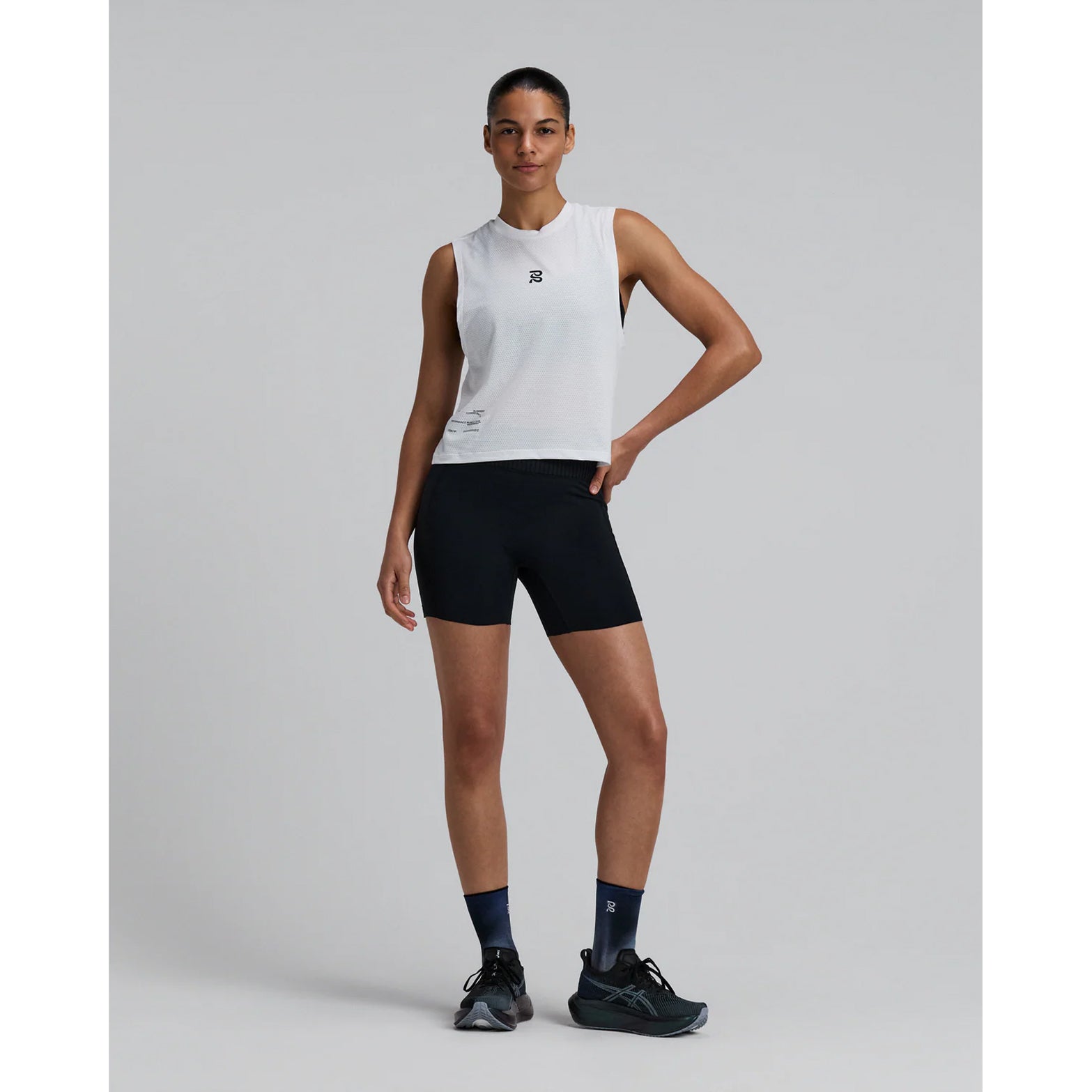 Bandit Micromesh Run Tank women's in White — full body front view worn on model showing sleeveless relaxed silhouette, crew neckline, Micromesh™ fabric drape and reflective logo detail at centre front
