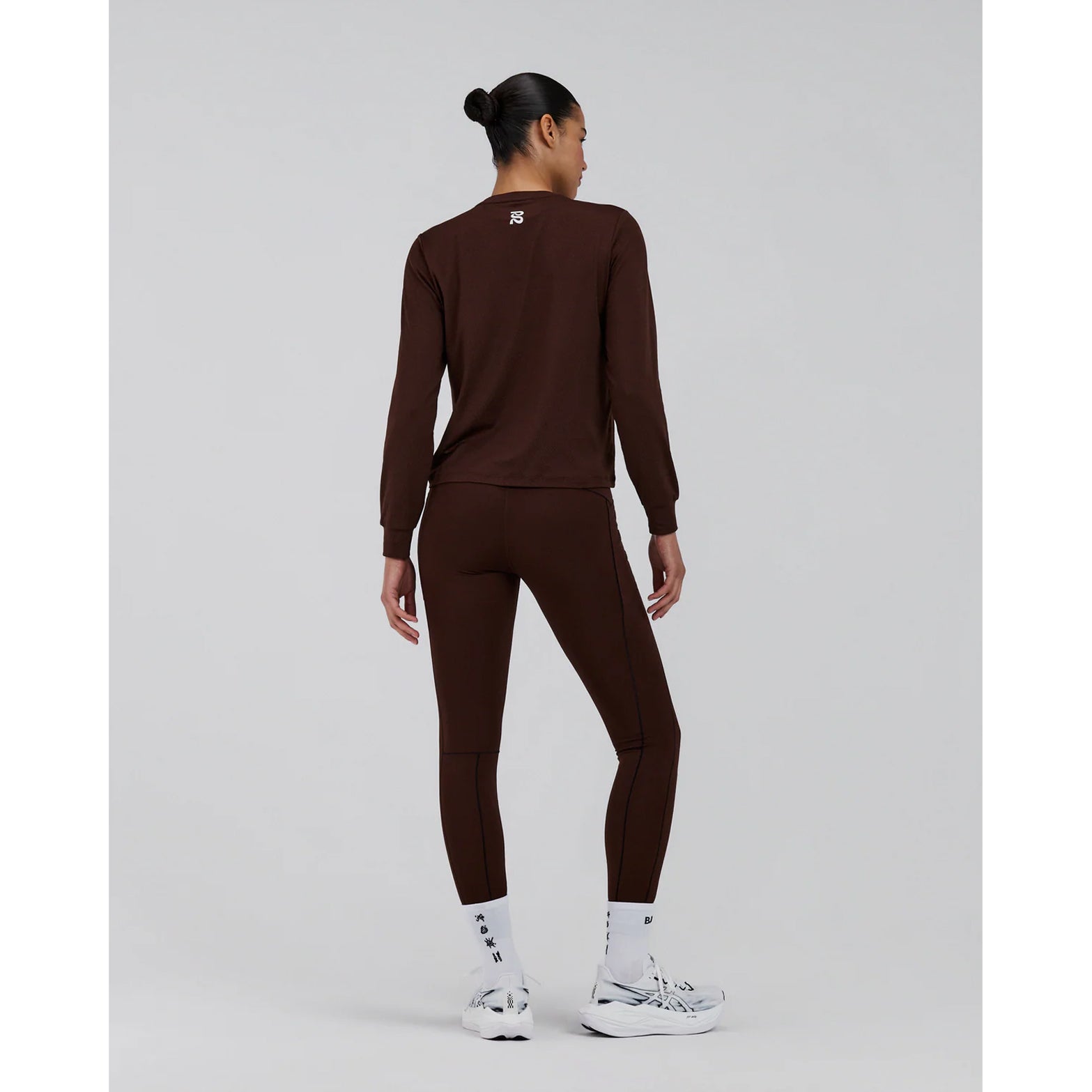 Women's Bandit Micromesh Top Cacao full body back view on female model showing breathable Micromesh fabric with dyed-to-match reflective graphic for visibility