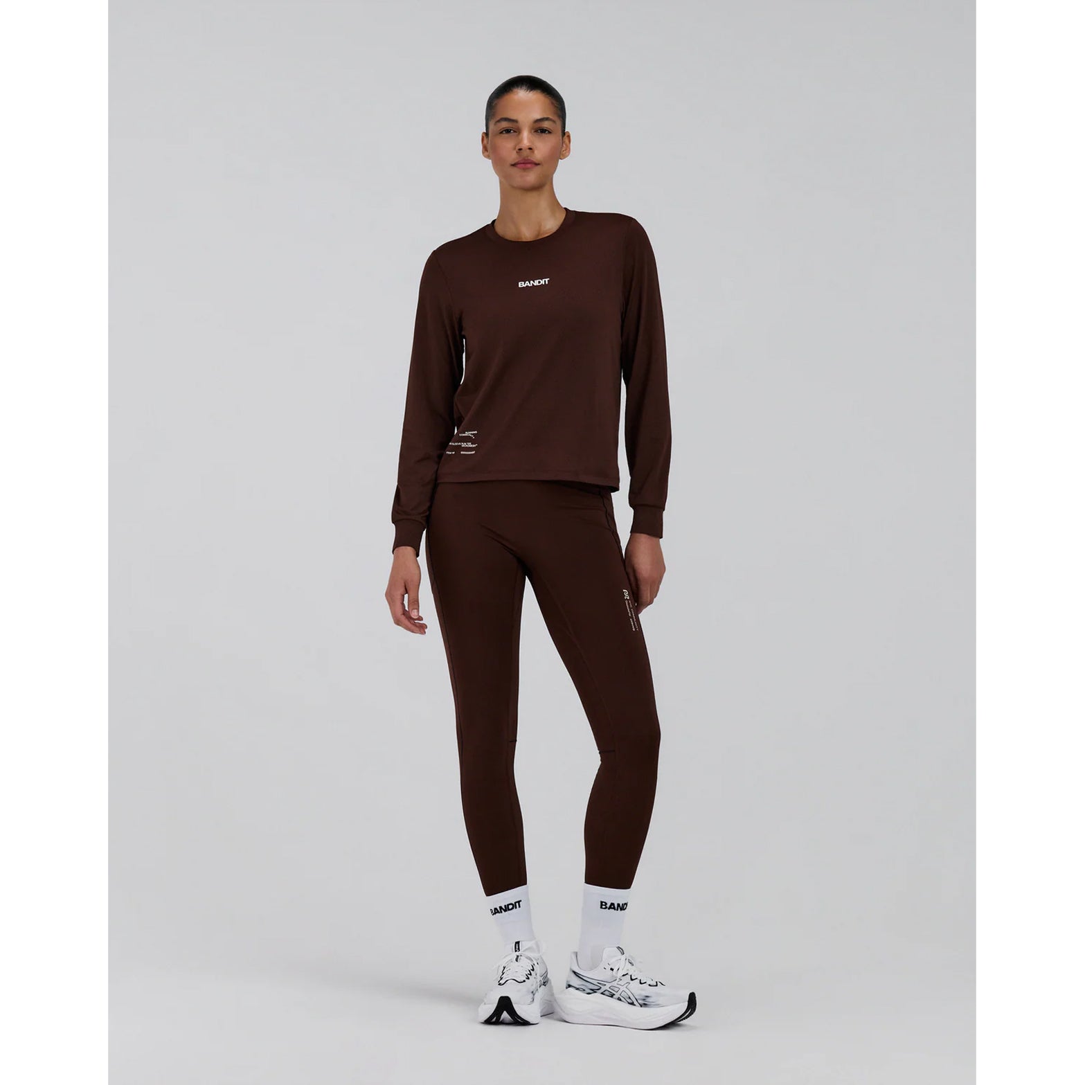 Women's Bandit Micromesh Top Cacao full body front view on female model showing relaxed fit long sleeve with advanced moisture management and reflective details