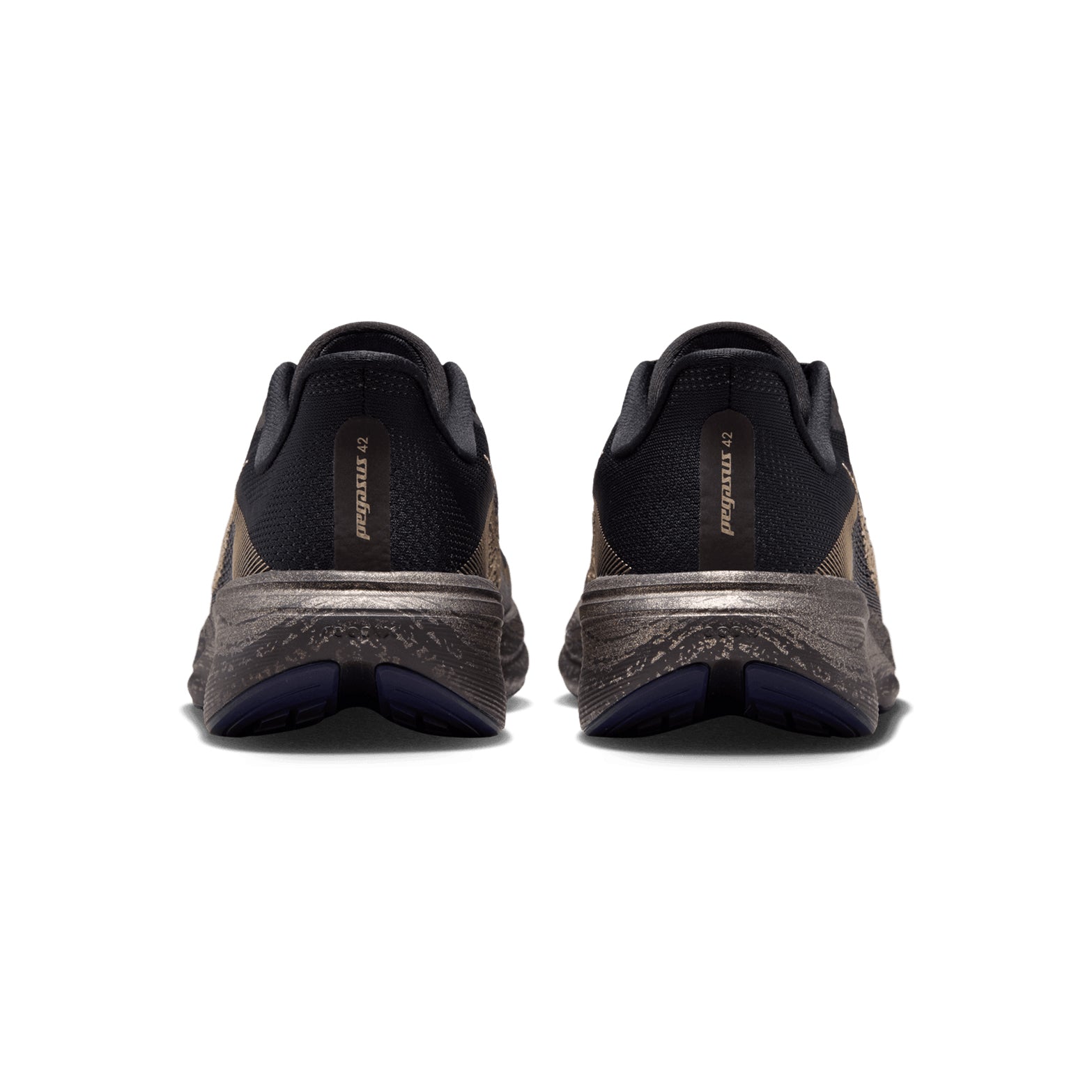 A pair of Women’s Pegasus 42 Keely Hodgkinson Running Shoes, shown from the back, feature black fabric uppers with pitch blue and blackened blue tones, accented by subtle blur details and set atop textured gray soles. Inspired by the performance-driven spirit of athletes like Keely Hodgkinson, these Nike shoes offer both comfort and style. The Nike brand name is visible on the heel tab of each shoe.