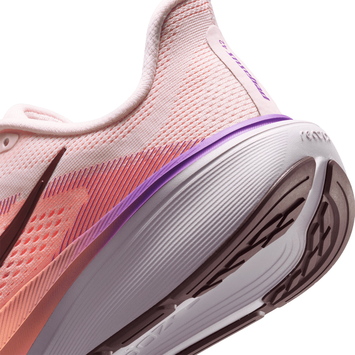 Women's Nike Pegasus 42 Running Shoes Chalk Orange Pulse Bright Violet Tattoo angled side and heel view showing sculpted full-length Air Zoom unit with ReactX foam midsole and greater toe spring for propulsive everyday road running