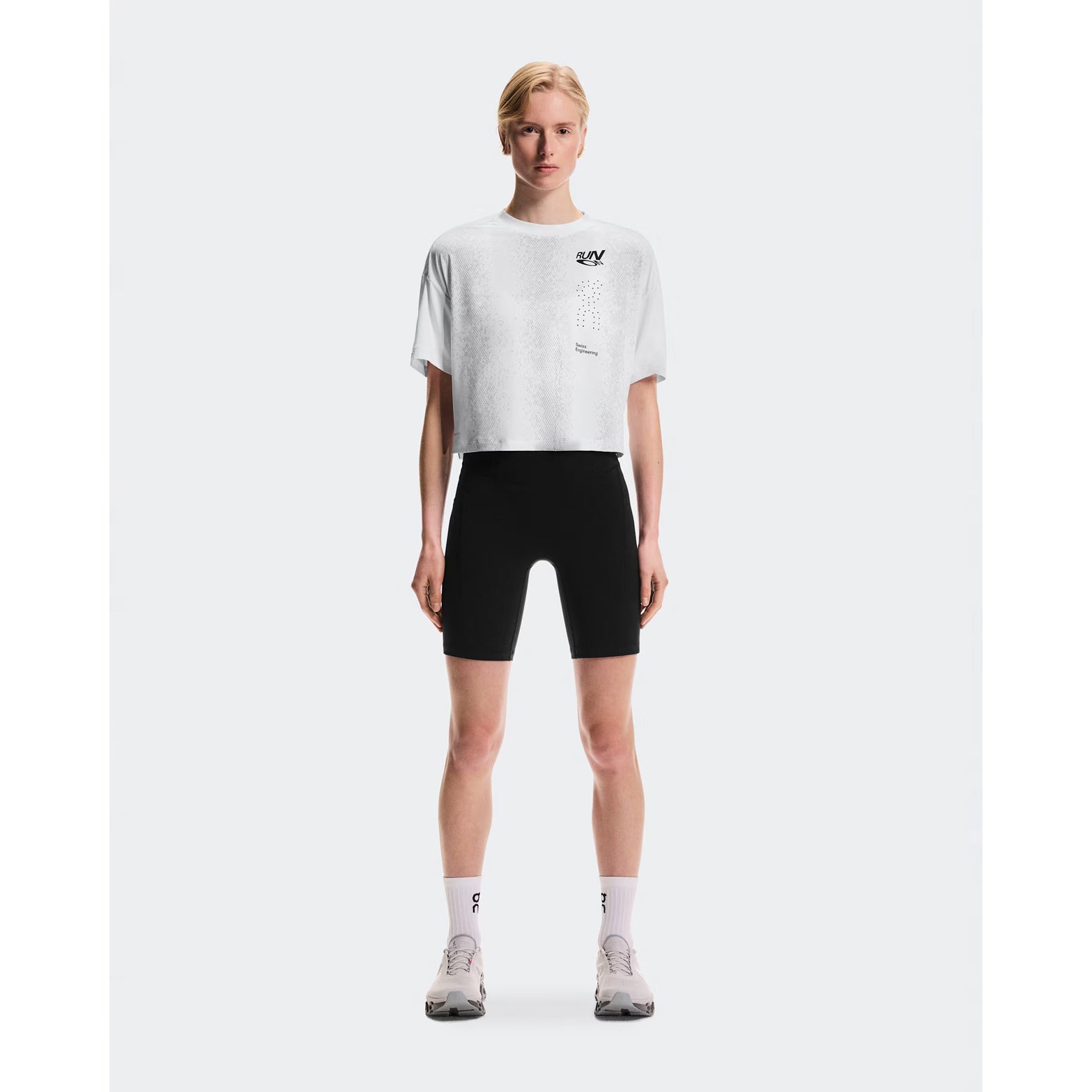 Women's On Performance Volt-T White full body front view on female runner showing relaxed fit with On DryTec moisture-wicking for running, training and post-workout wear