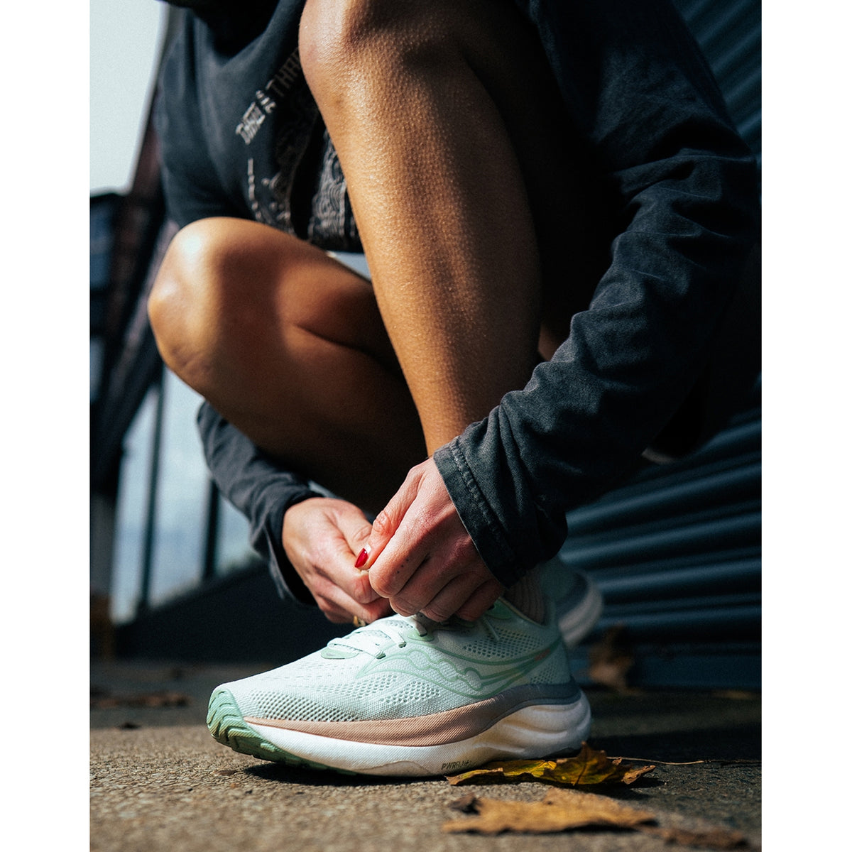 Women's Saucony Ride 19 Running Shoes  side view on female runner showing plush PWRRUN+ cushioning with smooth stride transitions for comfortable daily training across varied paces