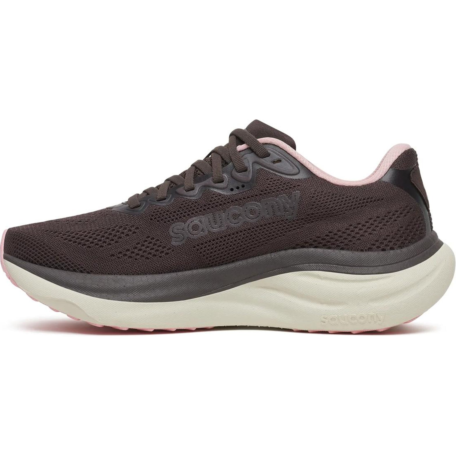 A side view of the Saucony Women’s Ride 19 Running Shoes in Torte / Eggshell shows a dark brown everyday running shoe featuring a thick white sole and pink accents around the collar and outsole. The mesh upper displays the Saucony logo, while cushioned PWRRUN+ foam provides comfortable support for daily runs.