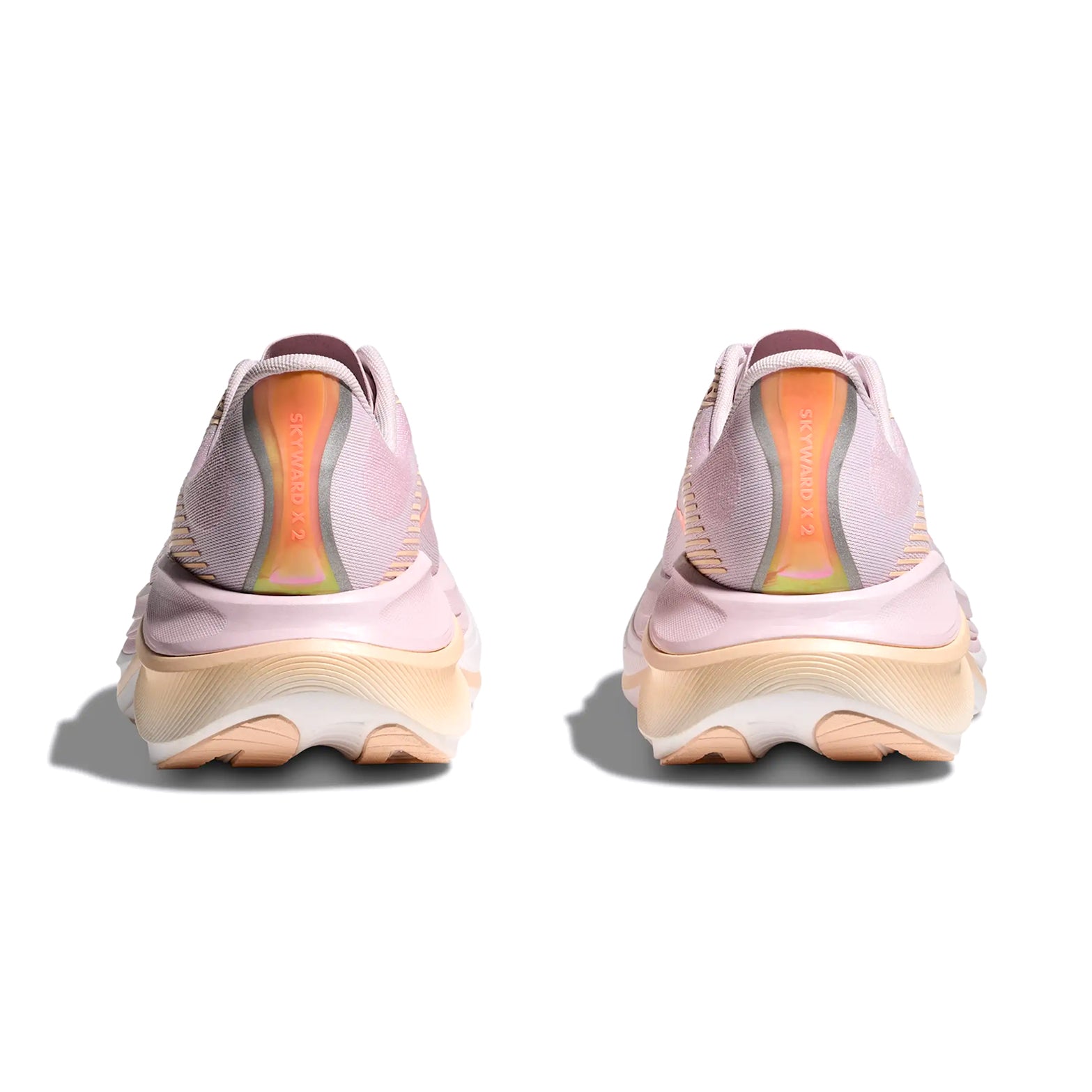 HOKA Skyward X 2 women's running shoe in Lilac Cream / Tangerine Glow — heel view showing Durabrasion rubber heel construction, reflective detailing and tangerine glow PEBA foam midsole contrast