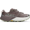 The Hoka Women’s Speedgoat 7 GORE-TEX Trail Running Shoes in Pebble Grey and Alabaster are shown from the side on a white background, featuring a brown and gray upper, white sole, Vibram outsole, and waterproof GORE-TEX labeling.
