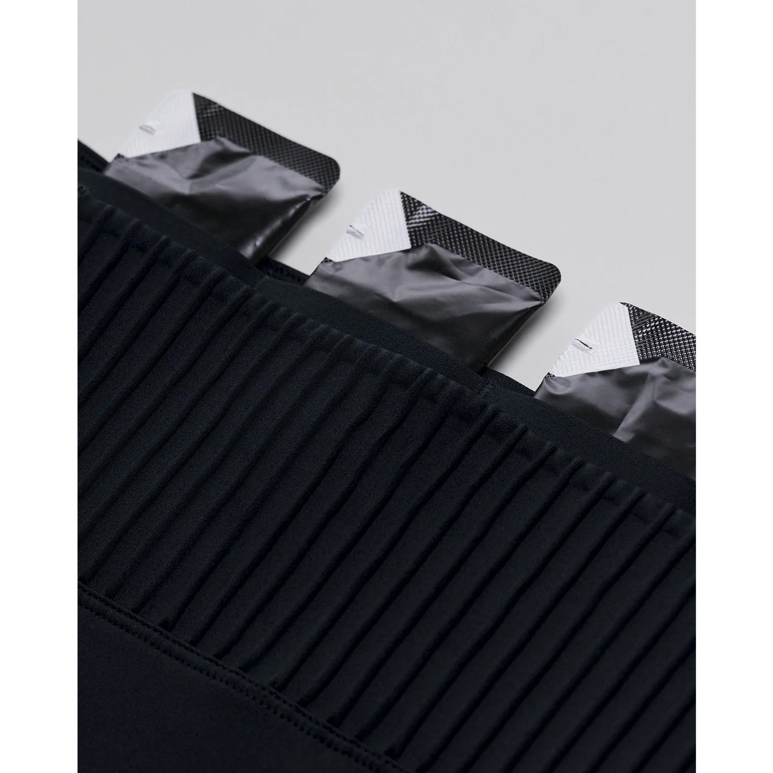 Women's Bandit Stamina-V High Waist 5 Inch Compression Shorts Black close-up of 2 gel pockets designed to disappear when running with accelerated evaporation technology