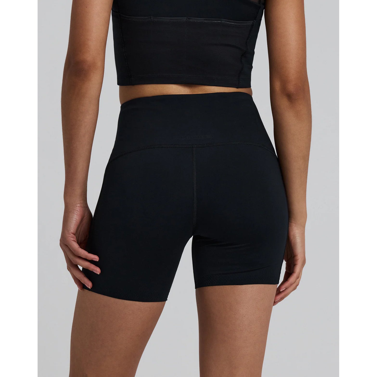Women's Bandit Stamina-V High Waist 5 Inch Compression Shorts Black back view showing waterproof phone pockets and lab-proven endurance-enhancing Stamina-V fabric