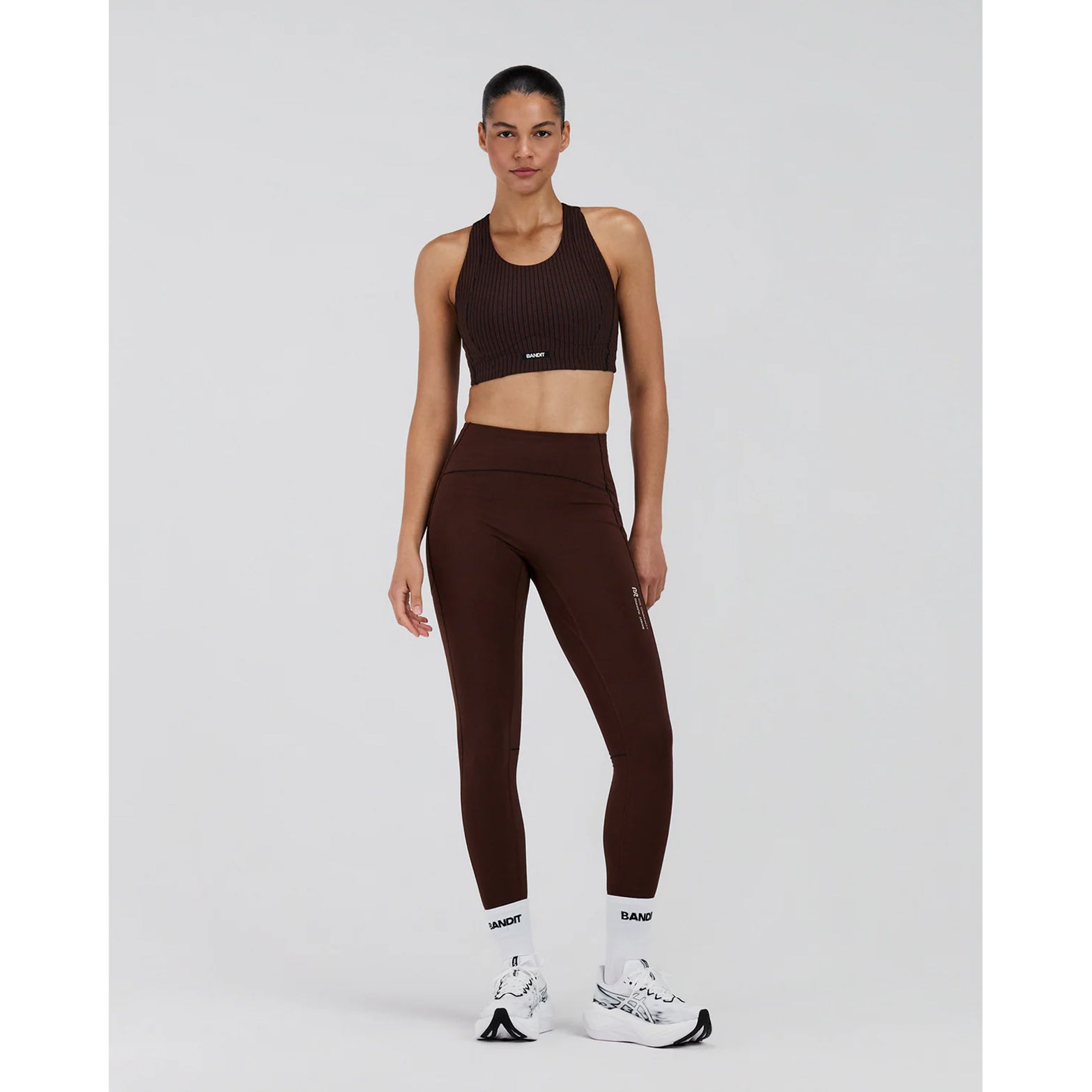 Women's Bandit Stamina-V High Waist Leggings full body front view on female runner showing high-waist compression with internal drawcord and 7-pocket system