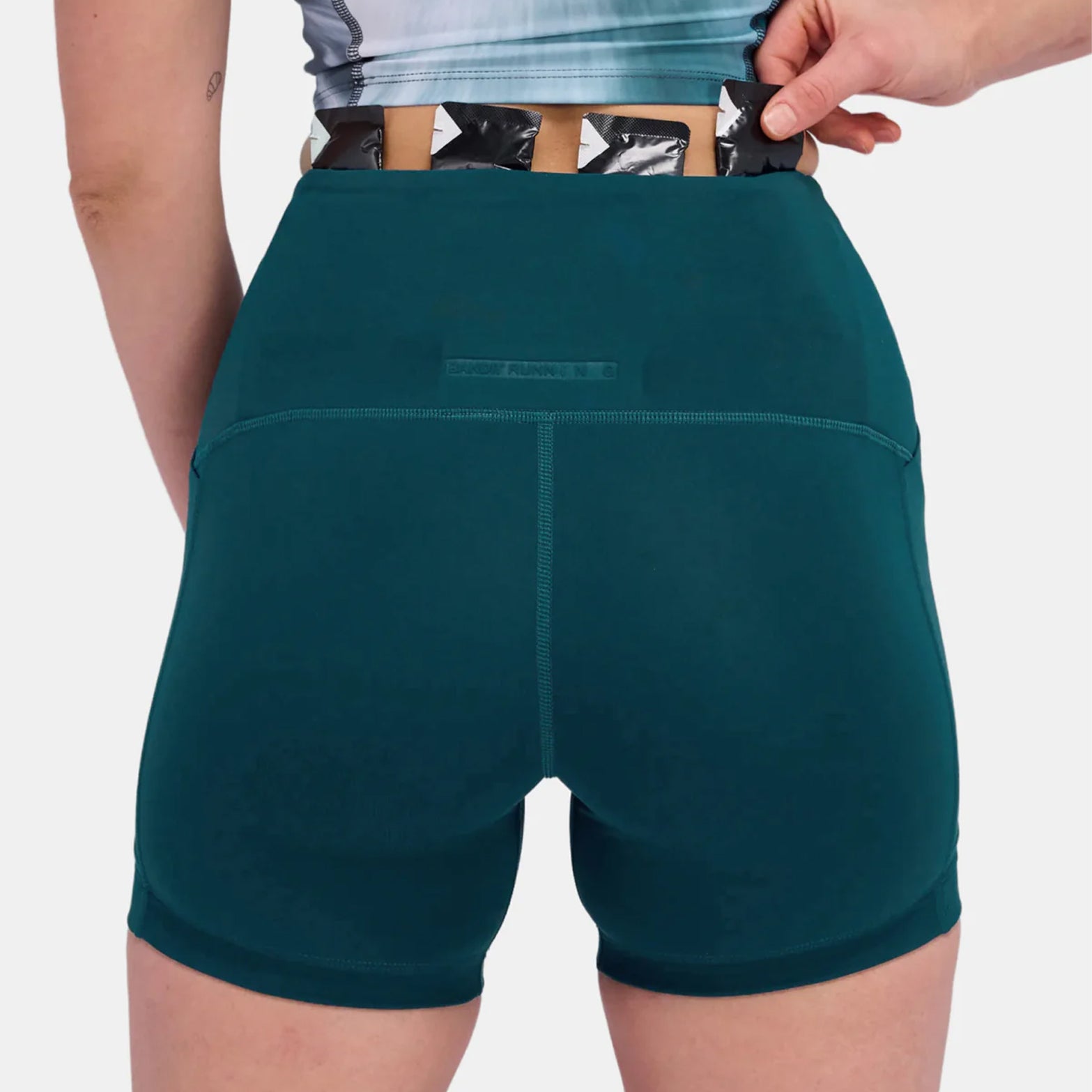 Bandit compression running shorts back view on model highlighting high-waist fit and reflective logos