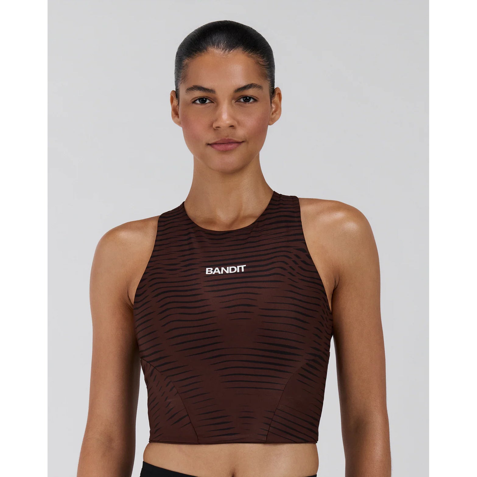 Women's Bandit Stamina Race Crop Organic Stripe Cacao front view showing double-layer matte-finished construction with built-in bra and embossed branding