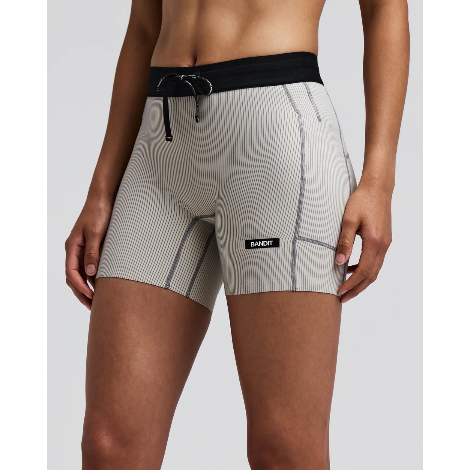 Women's Bandit Striped Cadence 5 Inch Compression Shorts Plaster Slate front view on female runner showing ultra-compressive Striped Cadence ribbed knit with custom anti-chafe waistband for race day performance