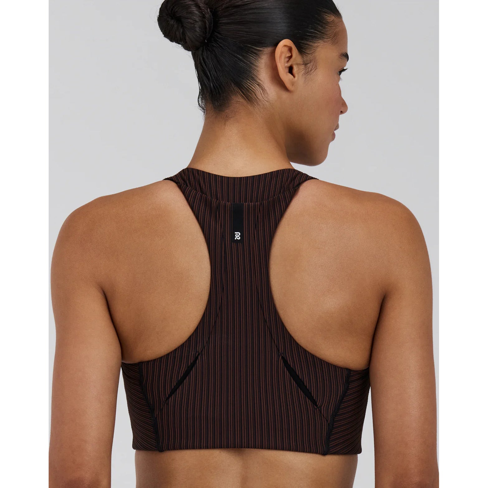 Bandit Striped Cadence Longline Bra women's in Cacao / Black — back view worn on model showing T-shirt loop detail at centre back, underarm gel pocket placement and cacao and black striped ribbed knit fit